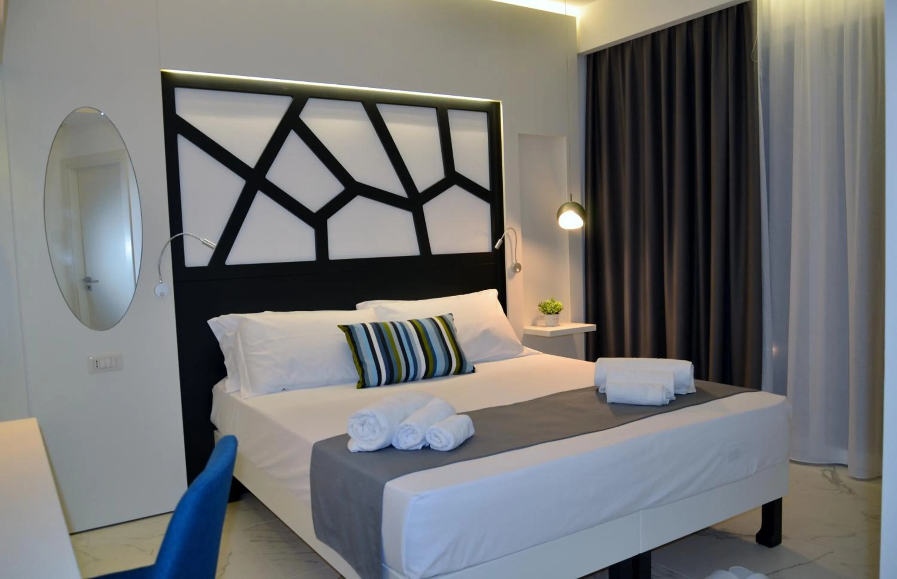 Bed in Centurio luxury rooms