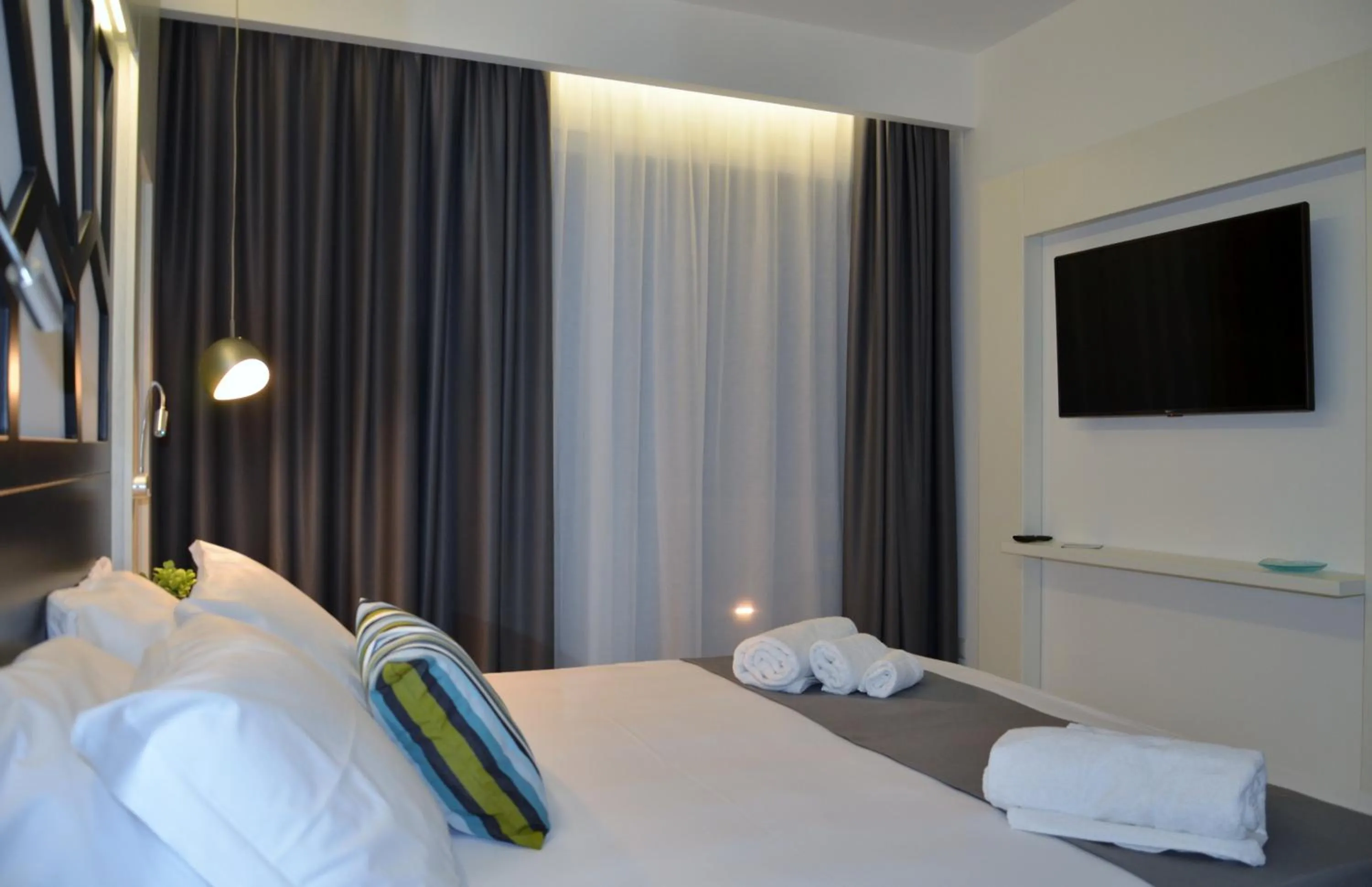 Bed in Centurio luxury rooms