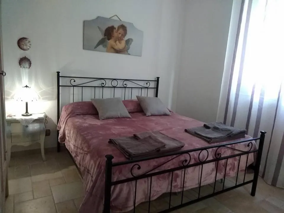 Photo of the whole room, Bed in Trulli Villa Gloria