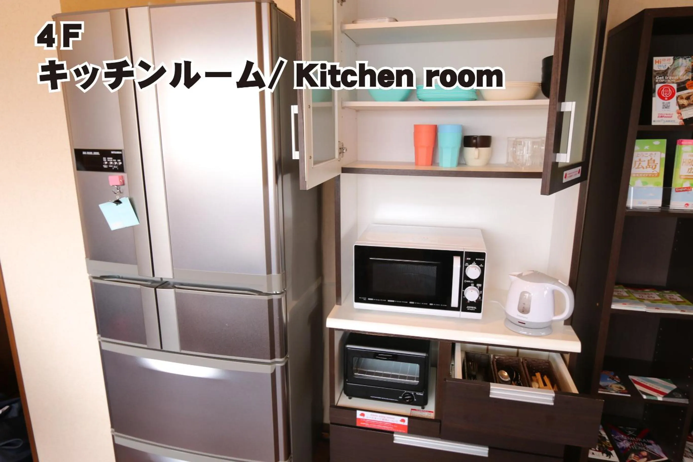Communal kitchen in RED HELMET House & Sports Bar Hiroshima