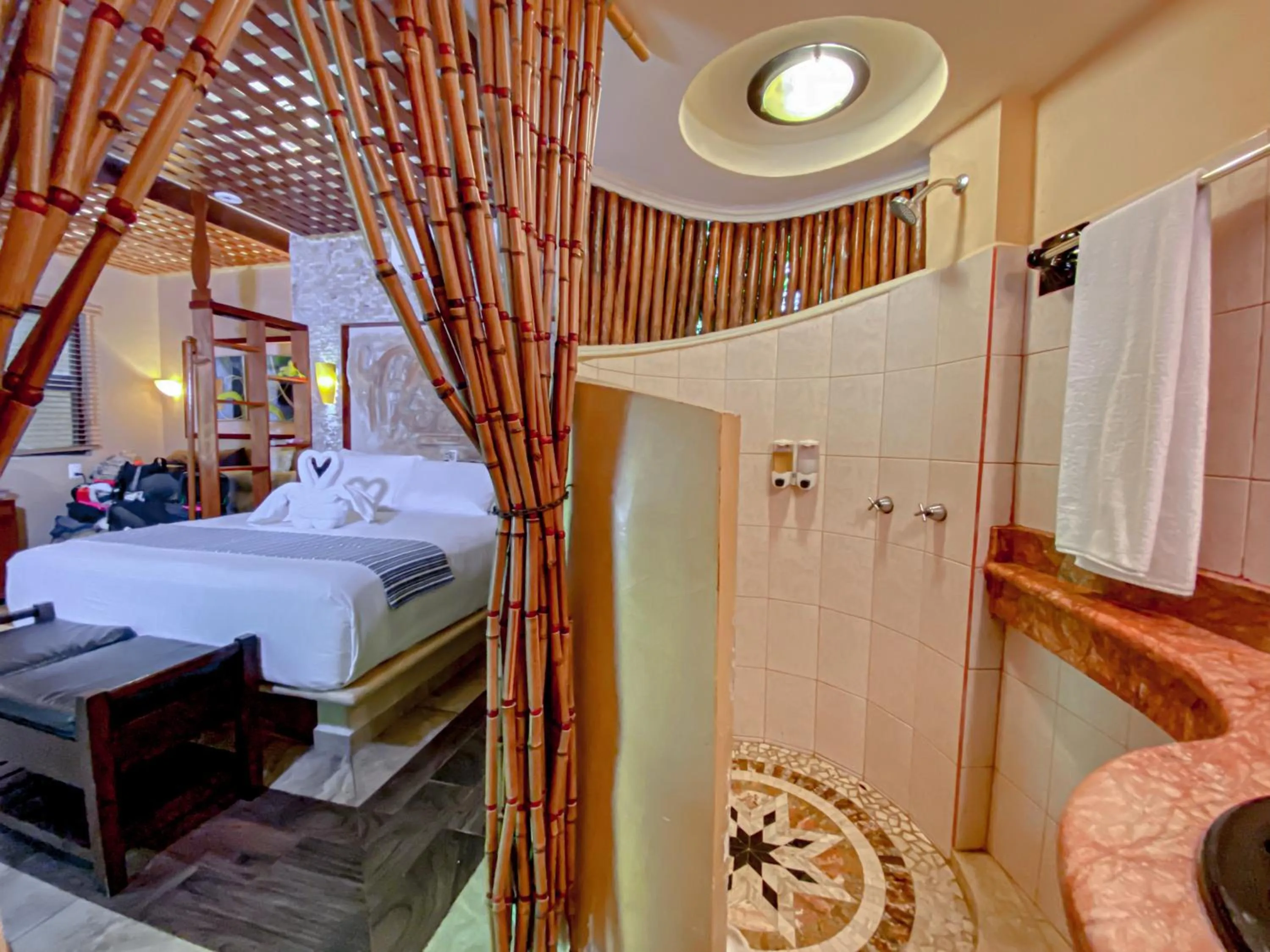 Photo of the whole room, Bed in Cocos Cabañas Playa del Carmen Adults Only