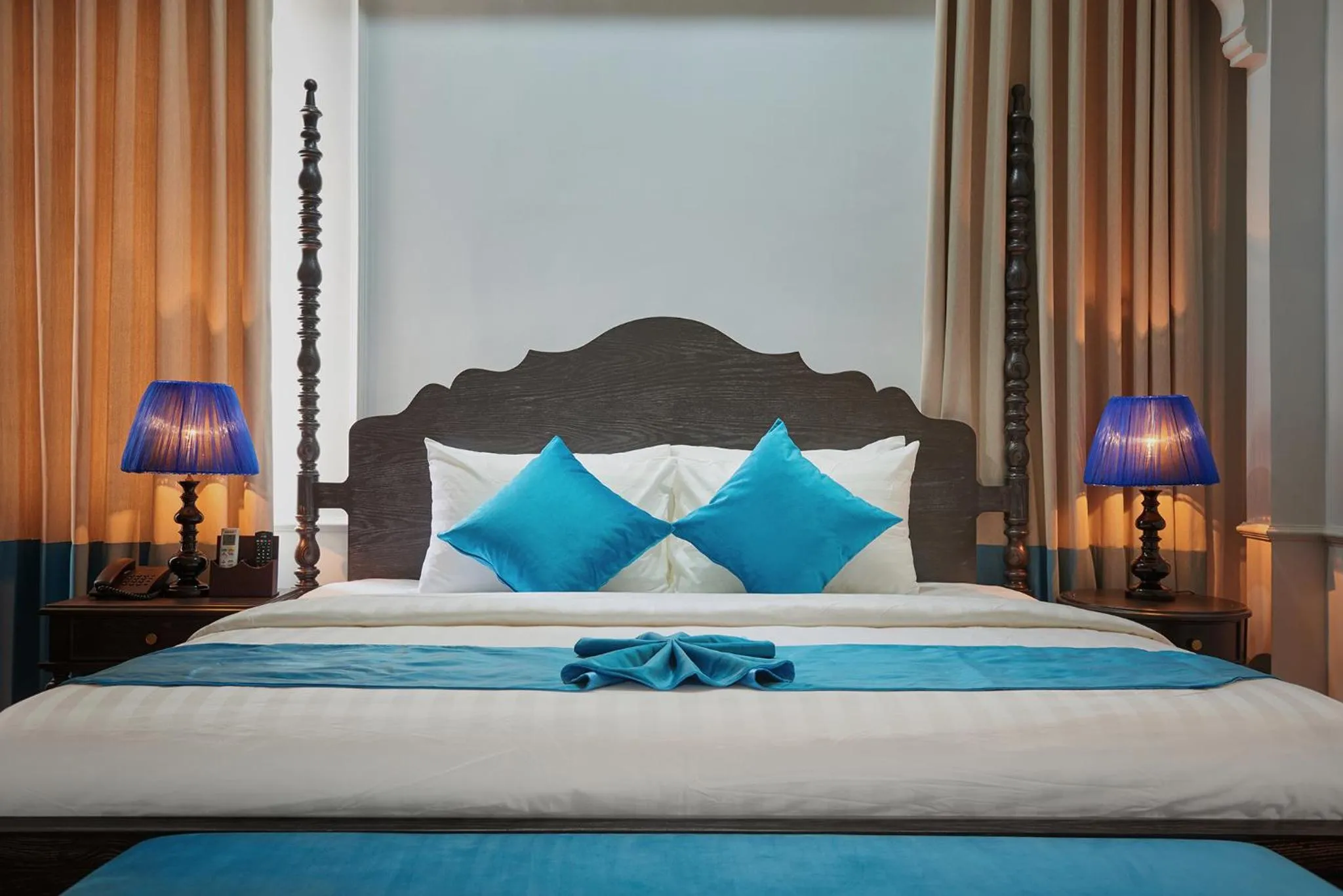 Bed in Manoir Des Arts Hotel