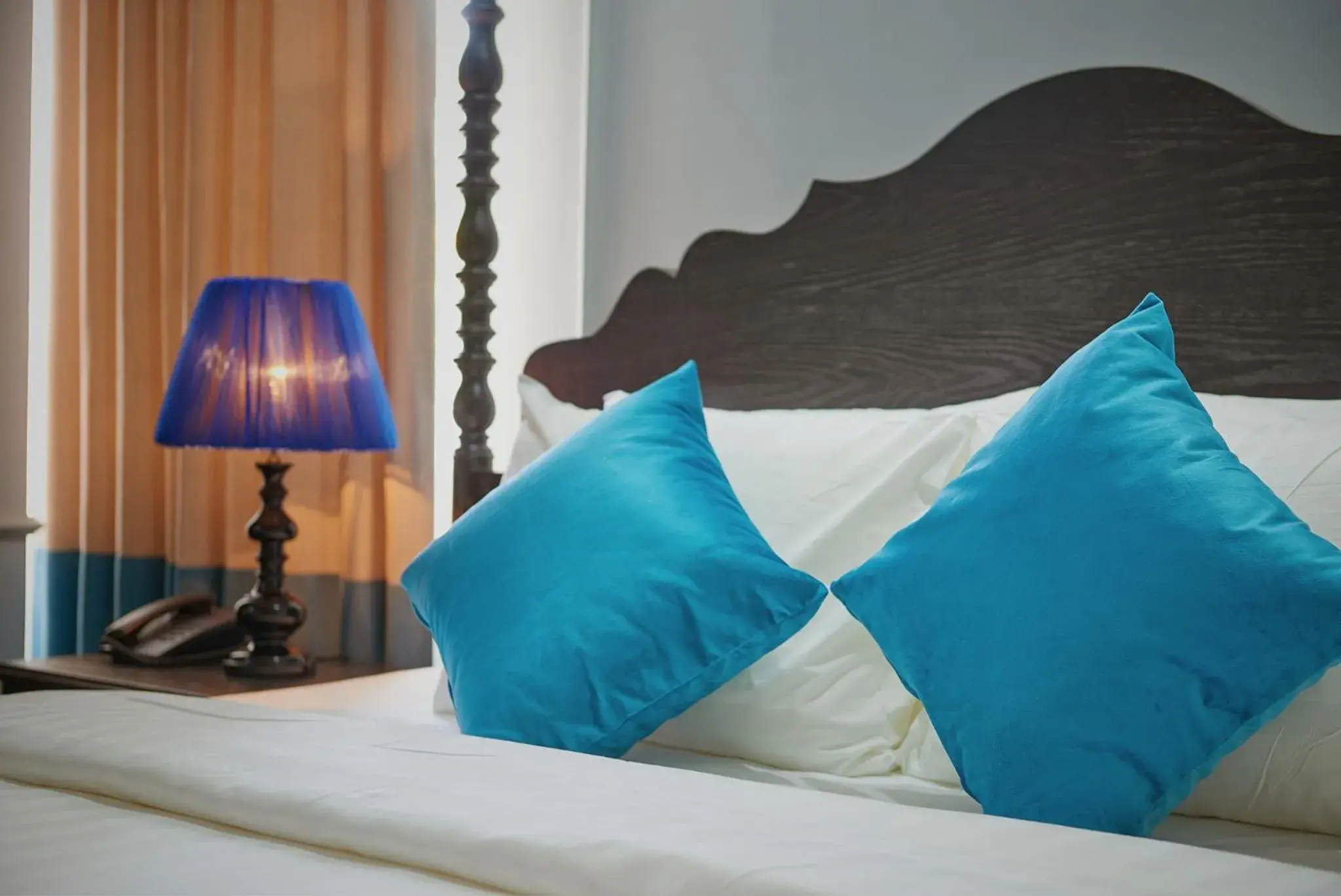 Bed in Manoir Des Arts Hotel Bed in Manoir Des Arts Hotel