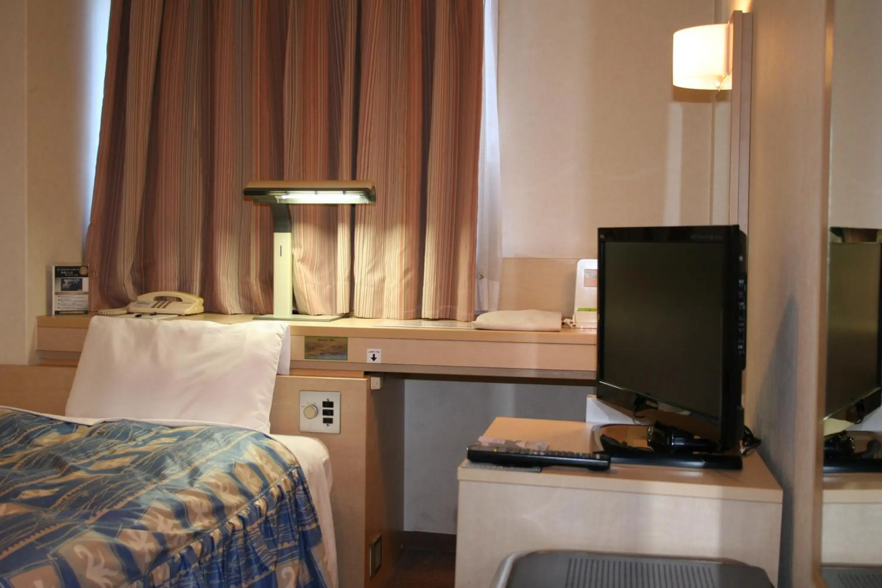 Bed in The Celecton Takamatsu Bed in The Celecton Takamatsu