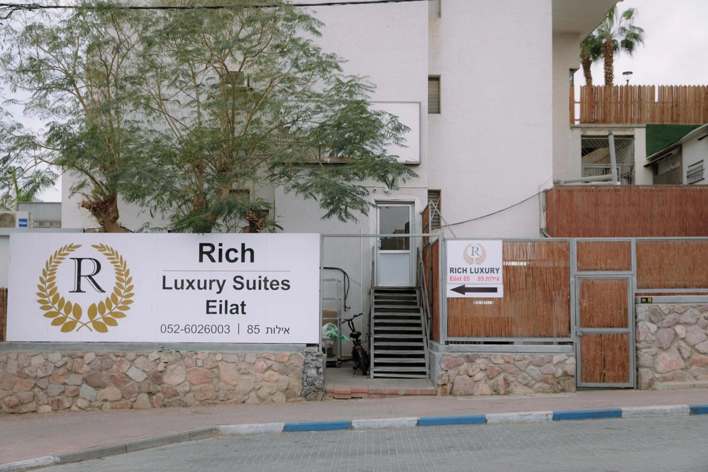 Property logo or sign in Rich apartments renovated & with modern design