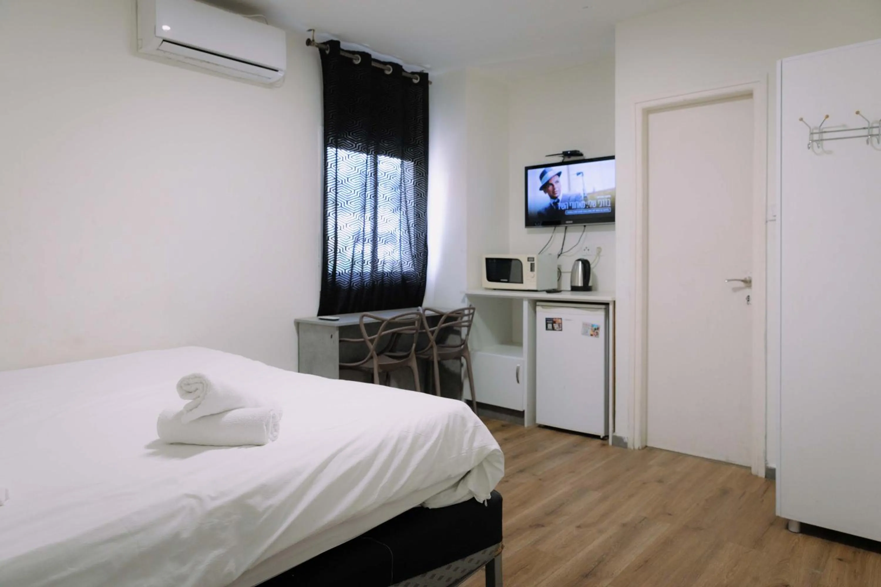 Bed in Rich Luxury Suites