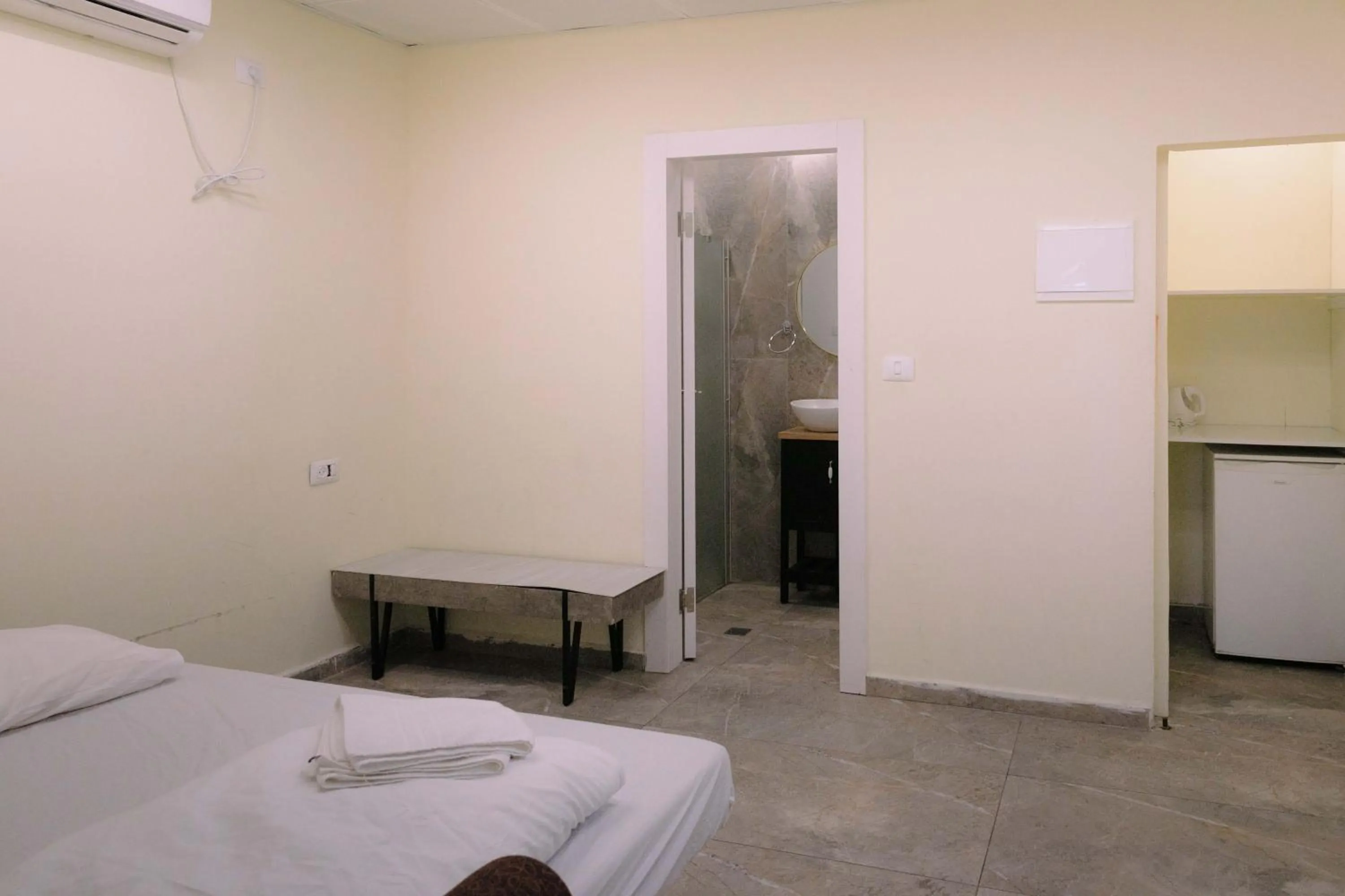 Bed in Rich Luxury Suites