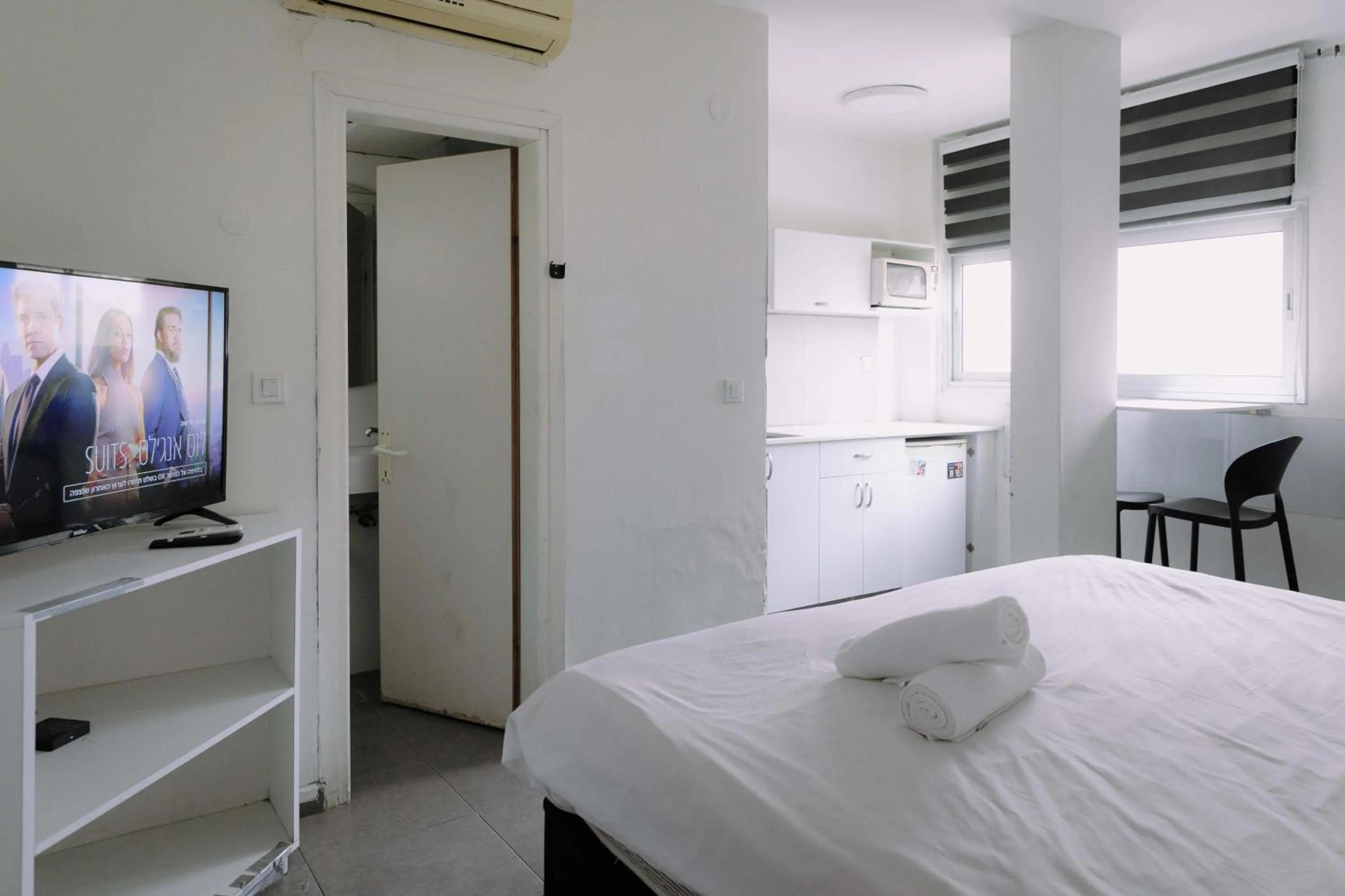 Bed in Rich Luxury Suites