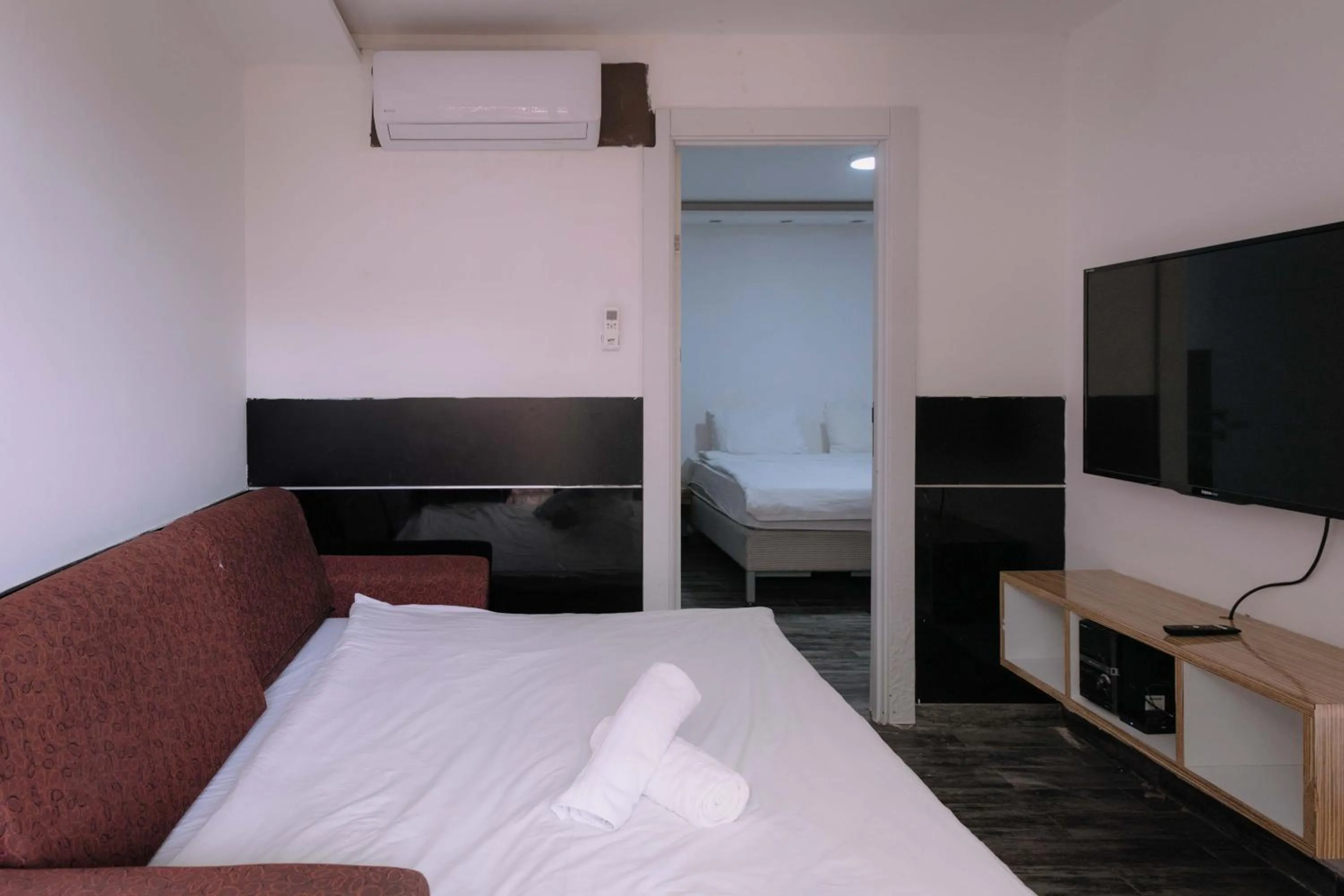 Bed in Rich Luxury Suites