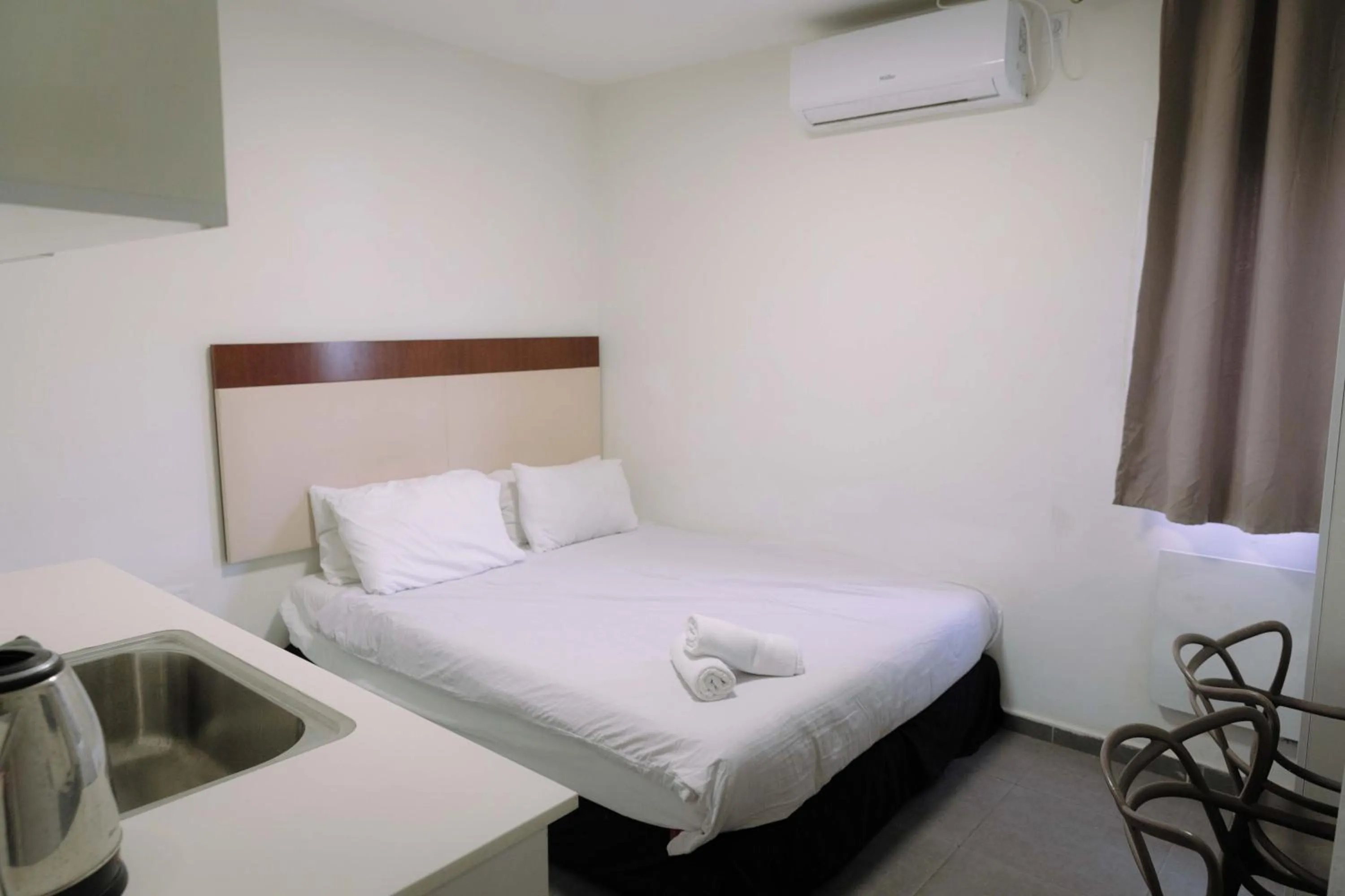 Bed in Rich Luxury Suites