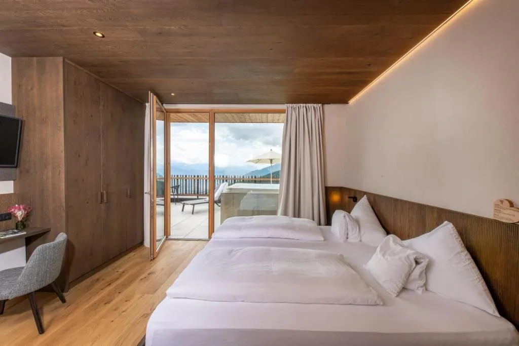 Bed in Tratterhof Mountain Sky Hotel