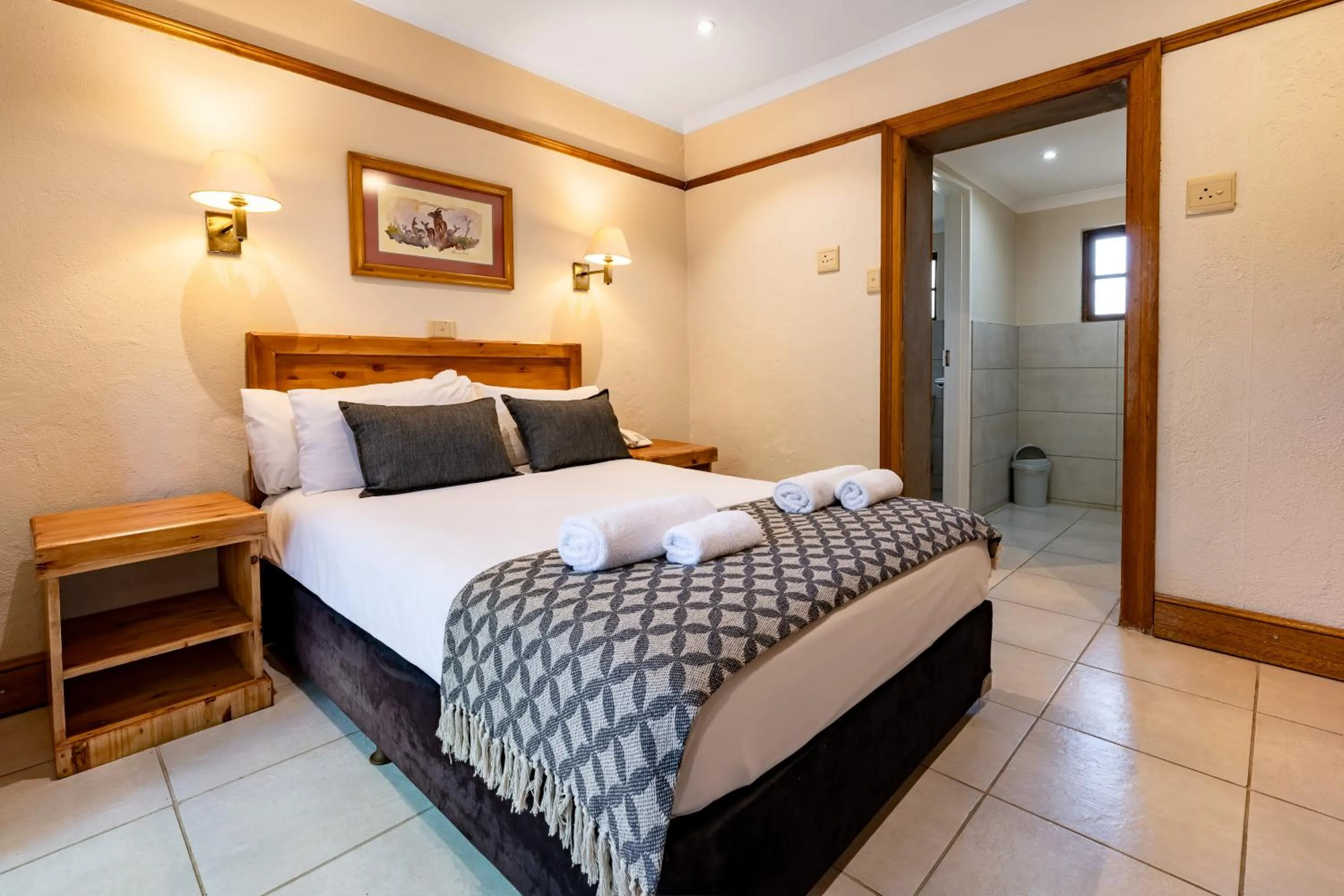 Bed in Hotel Numbi & Garden Suites