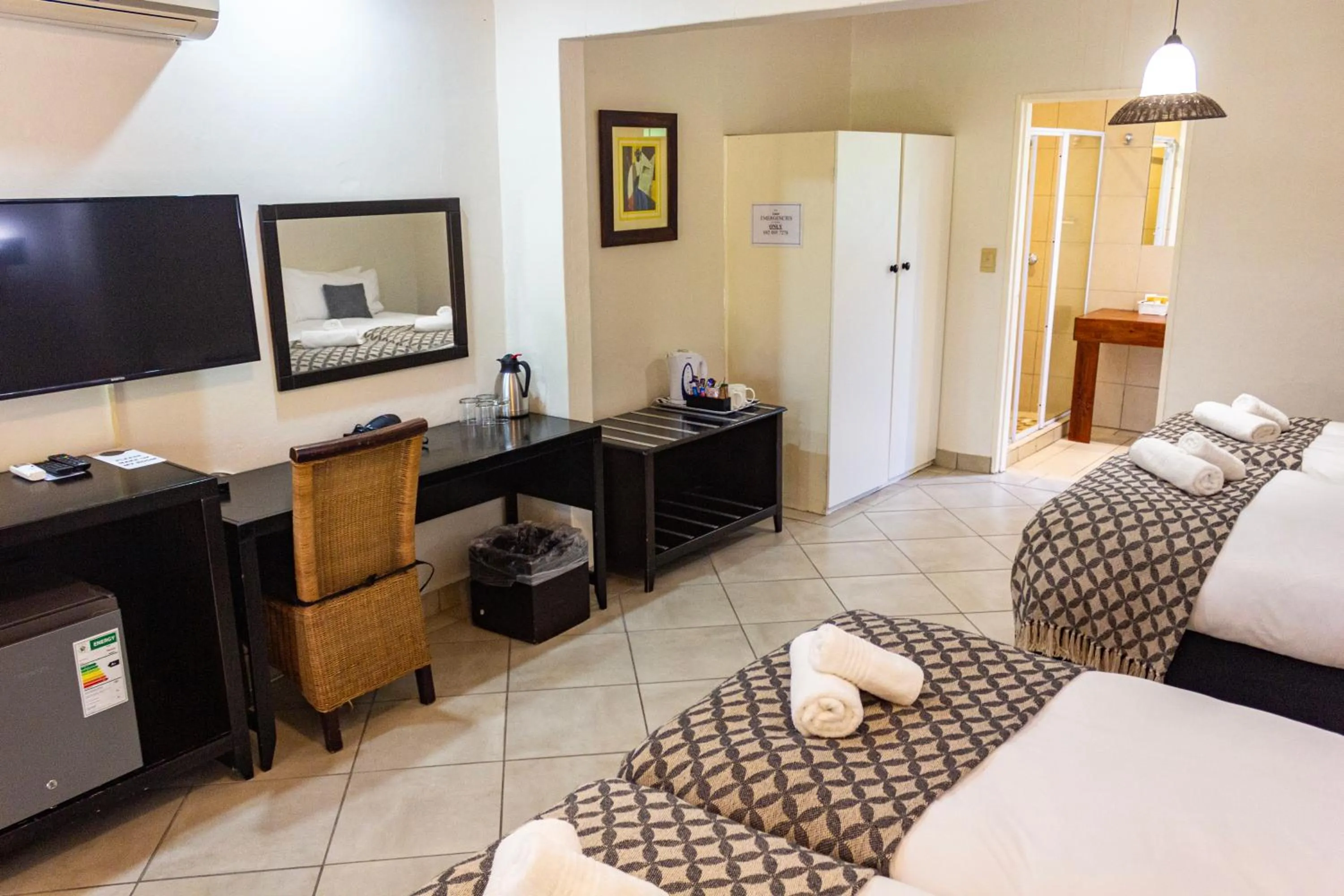 Photo of the whole room, Bed in Hotel Numbi & Garden Suites