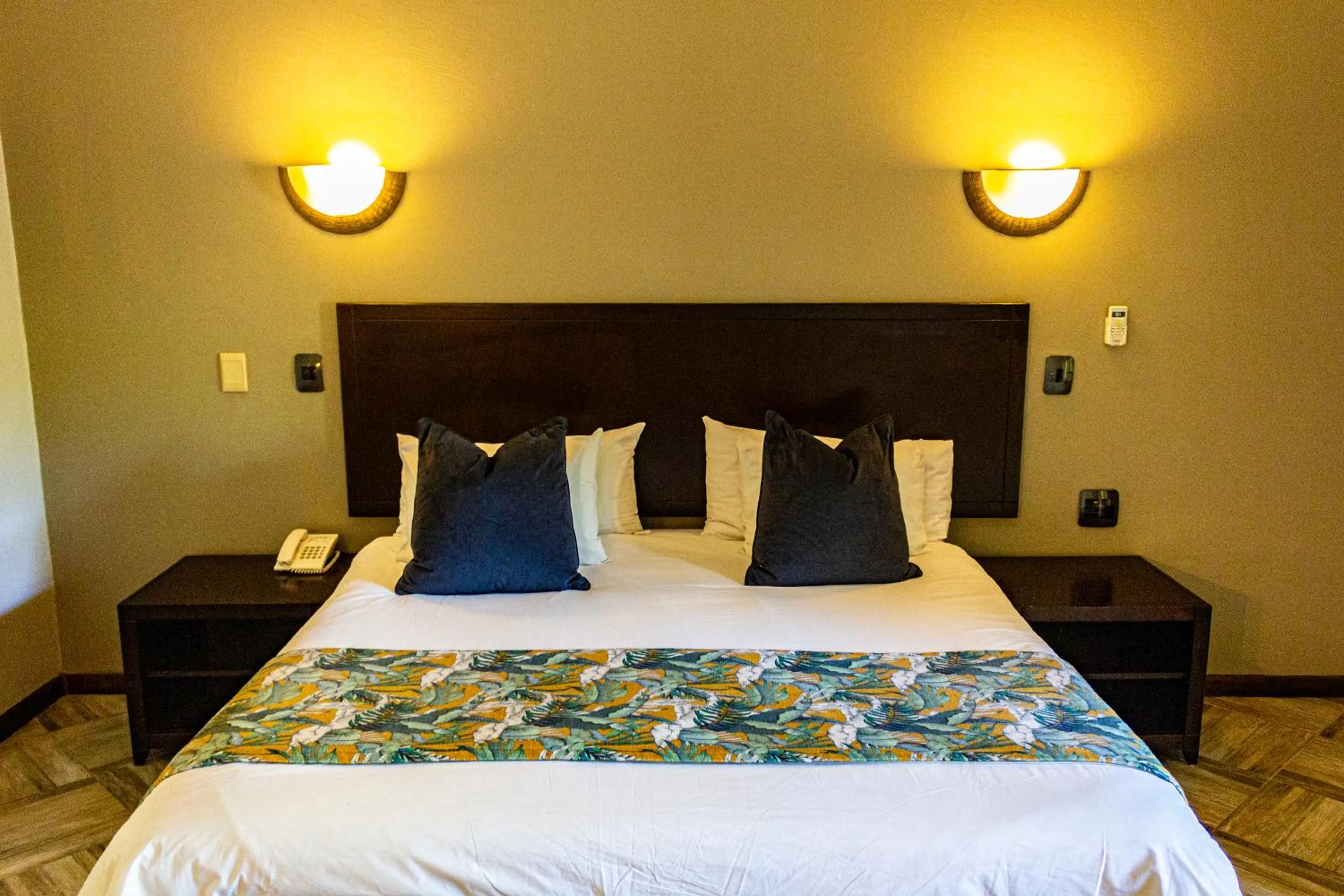 Bed in Hotel Numbi & Garden Suites