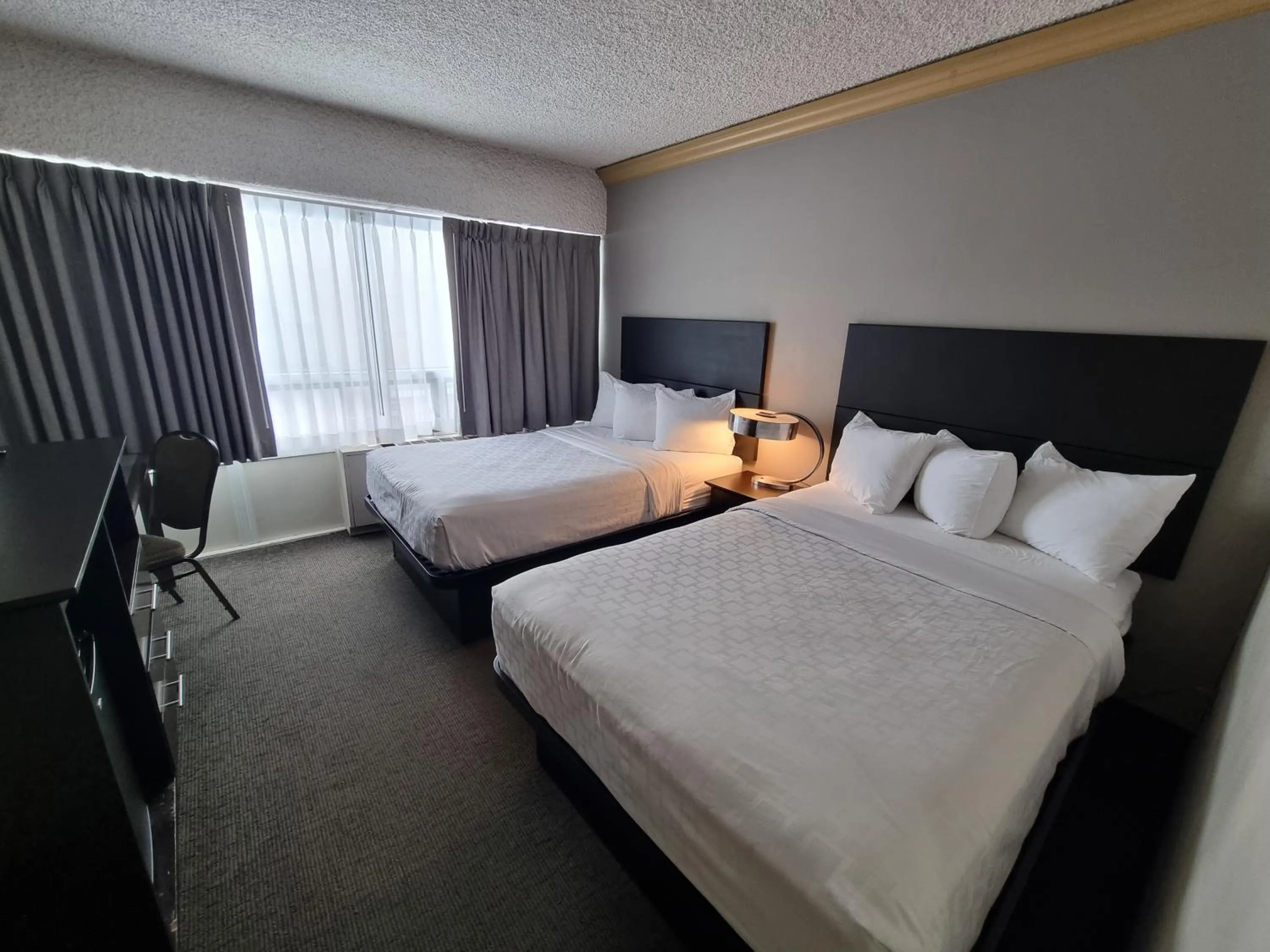 Photo of the whole room, Bed in Travelodge by Wyndham Trois-Rivieres