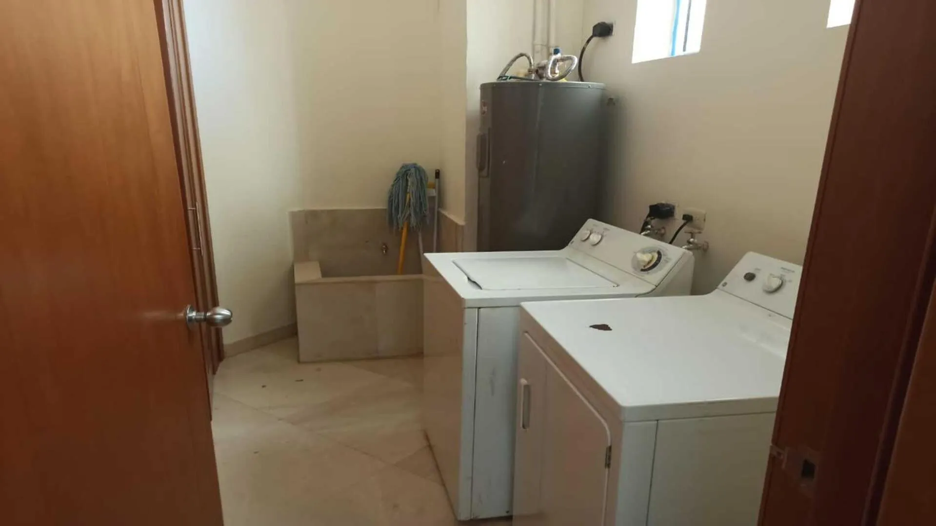 washing machine in Luna Blanca Penthouse by Kivoya