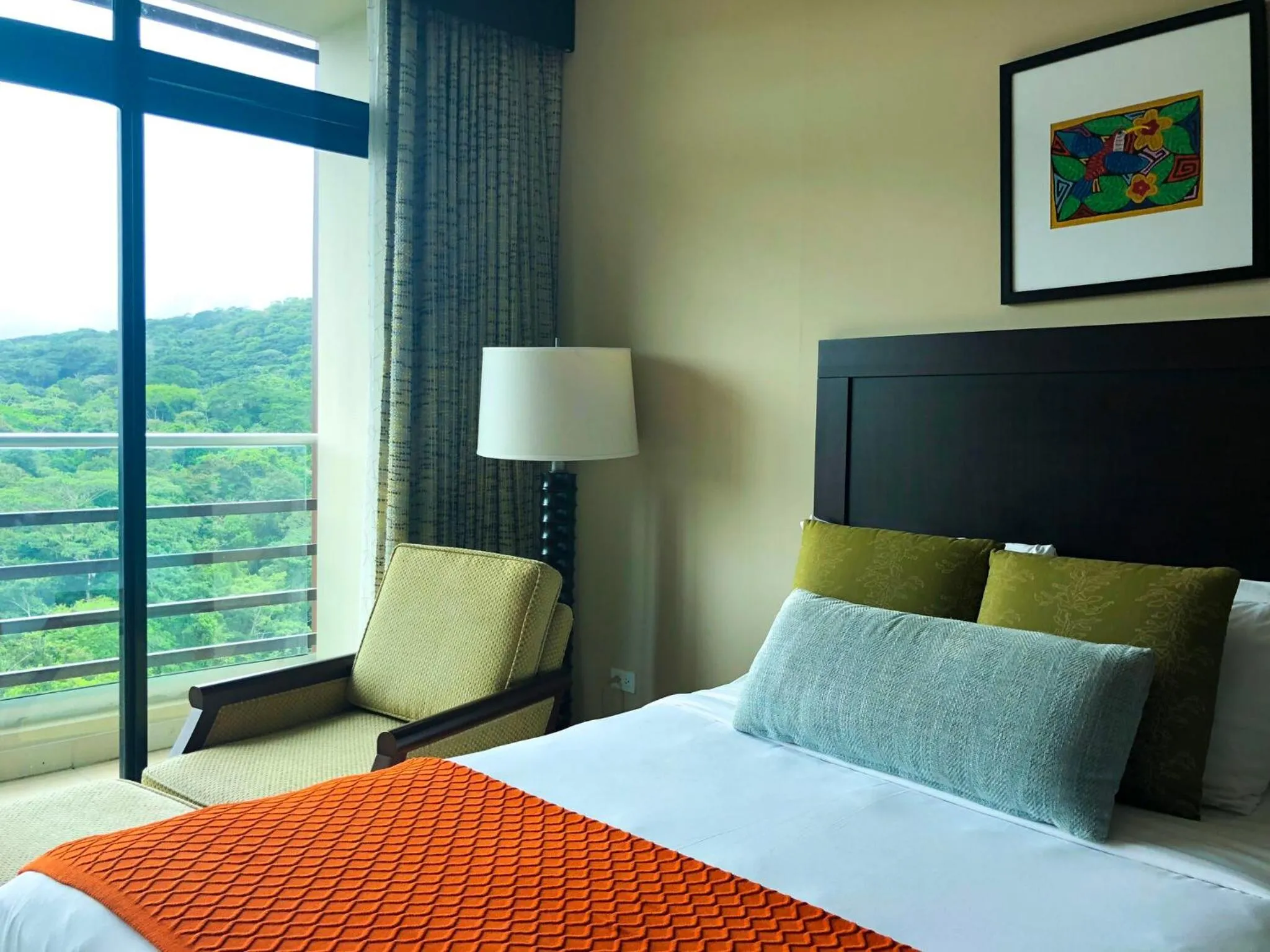 Bed in Summit Rainforest Golf Resort & All Inclusive