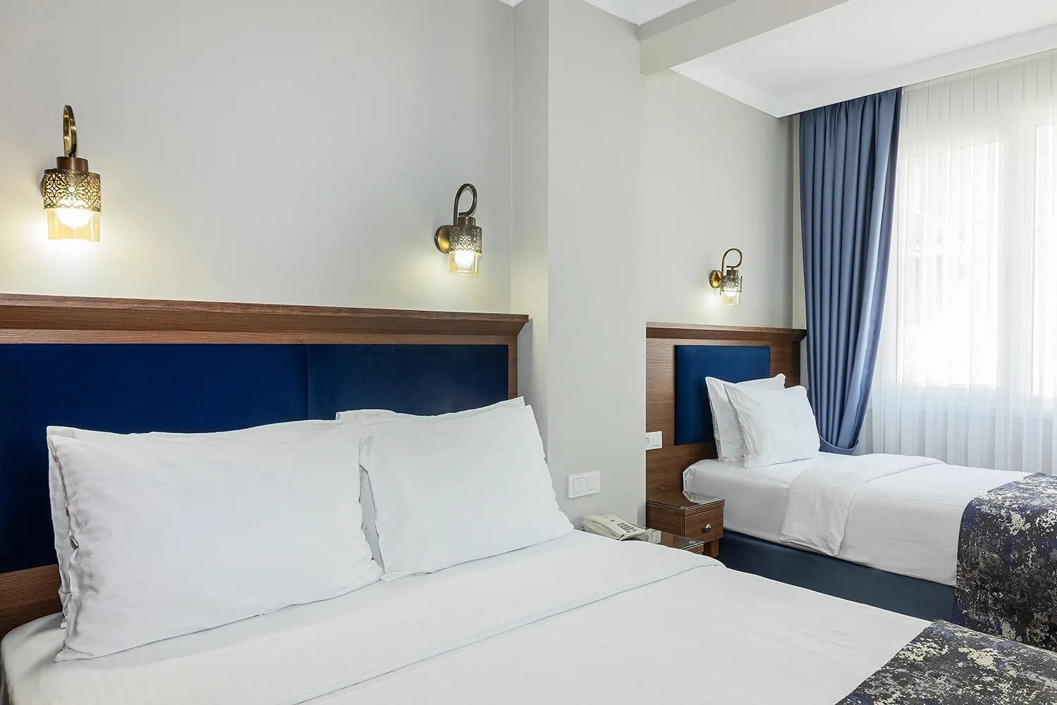 Bed in Aristocrat Hotel