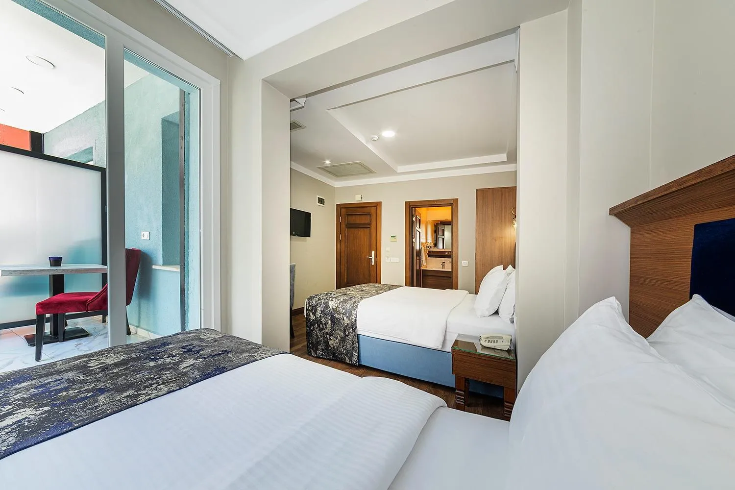 Bed in Aristocrat Hotel