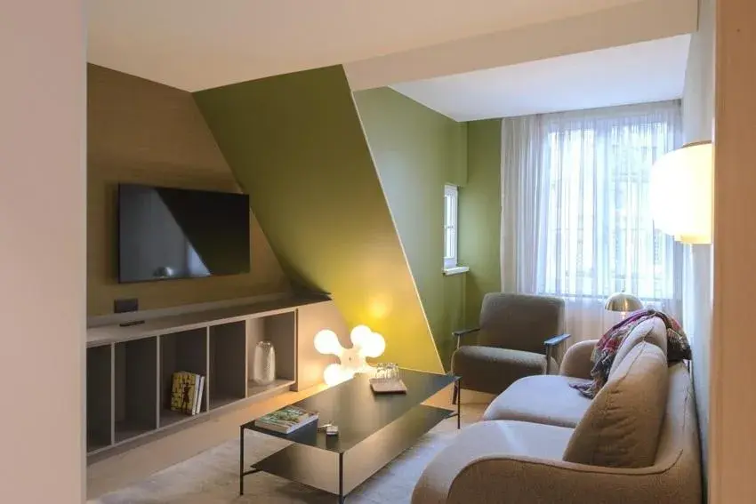 Seating area, Bed in Logis Hôtel Restaurant Au Cerf d'Or Seating area, Bed in Logis Hôtel Restaurant Au Cerf d'Or