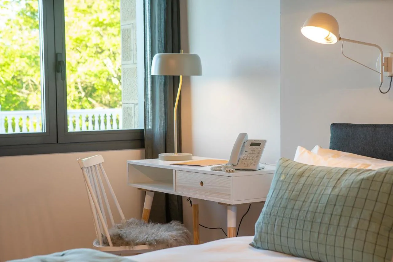 Seating area, Bed in IXUA Hotela