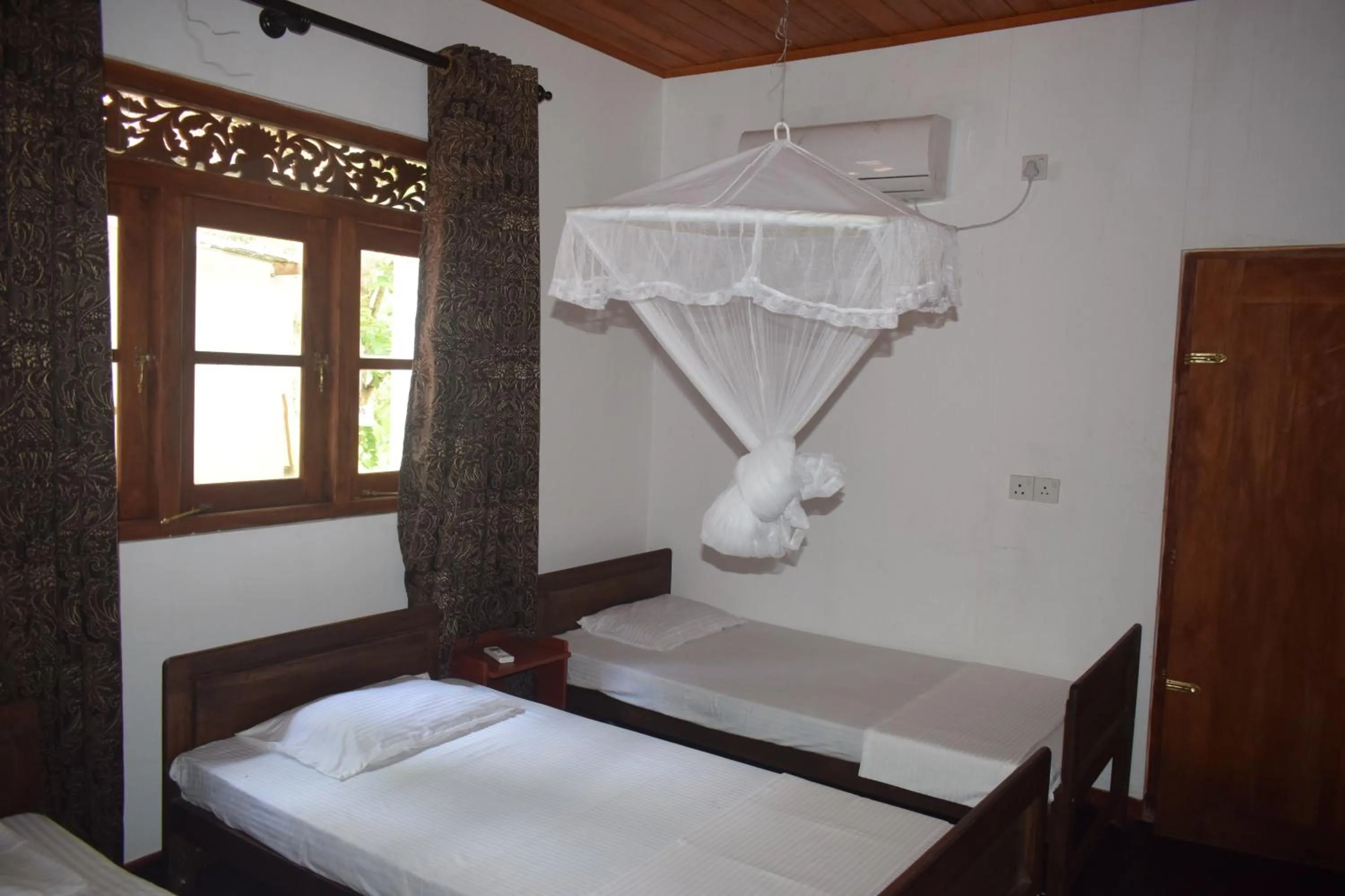 Bed in Green Herbal Ayurvedic Eco-Lodge