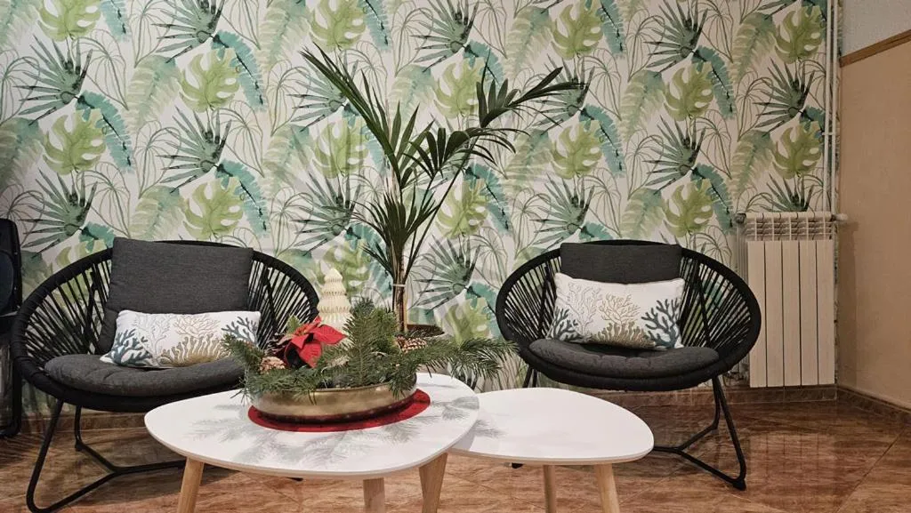 Communal lounge/ TV room in Hostal Rio De Castro