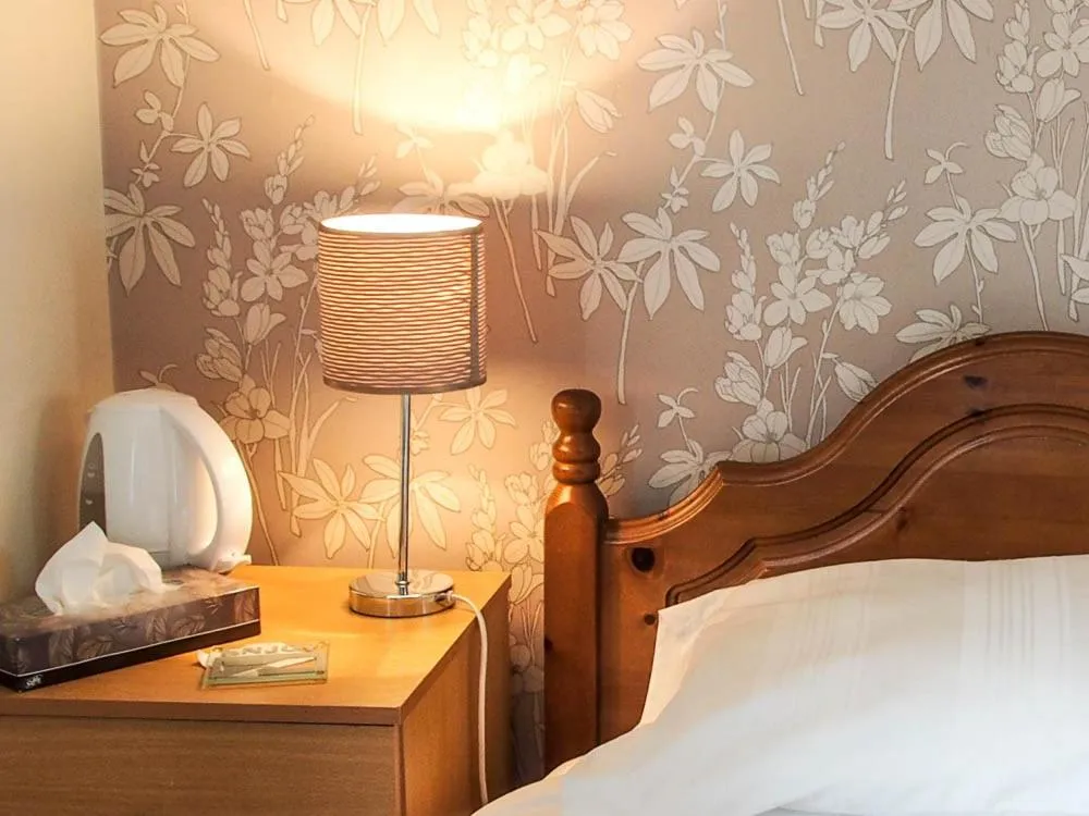 Bed in Leaded Light Guest House