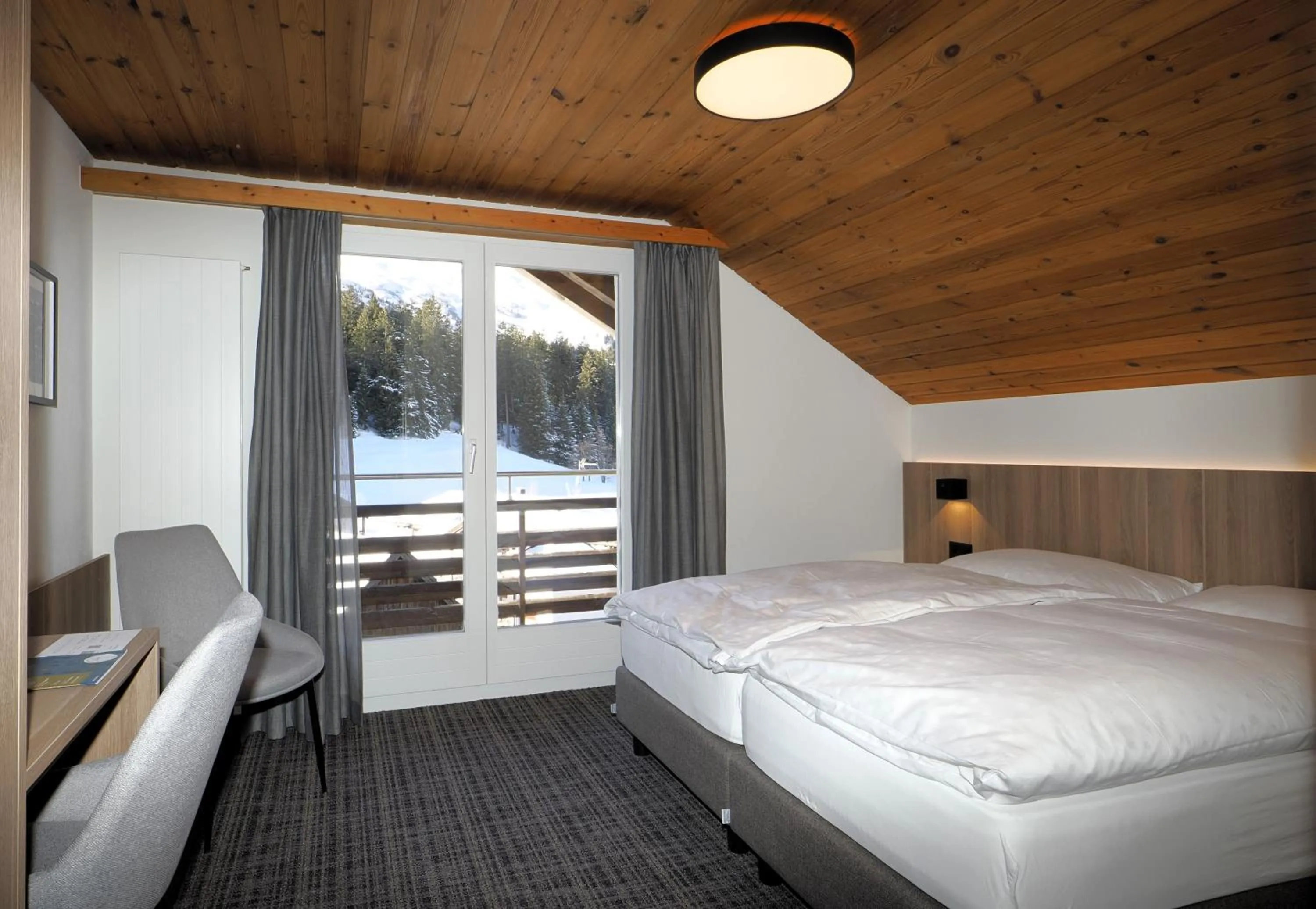 Photo of the whole room, Bed in Hotel Alpina Parpan