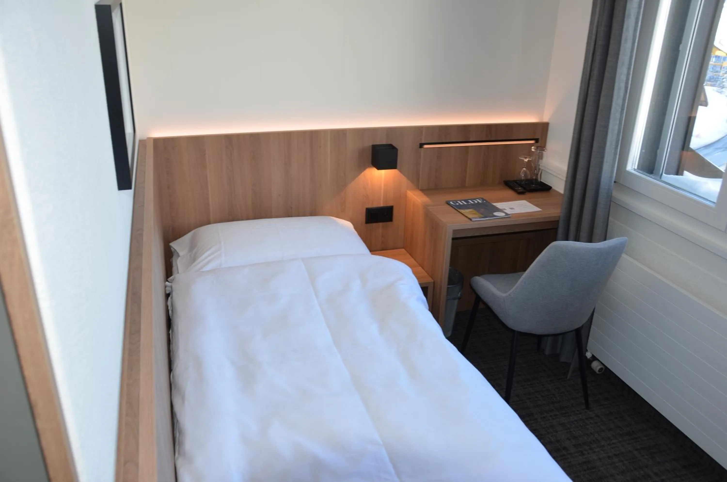 Photo of the whole room, Bed in Hotel Alpina Parpan