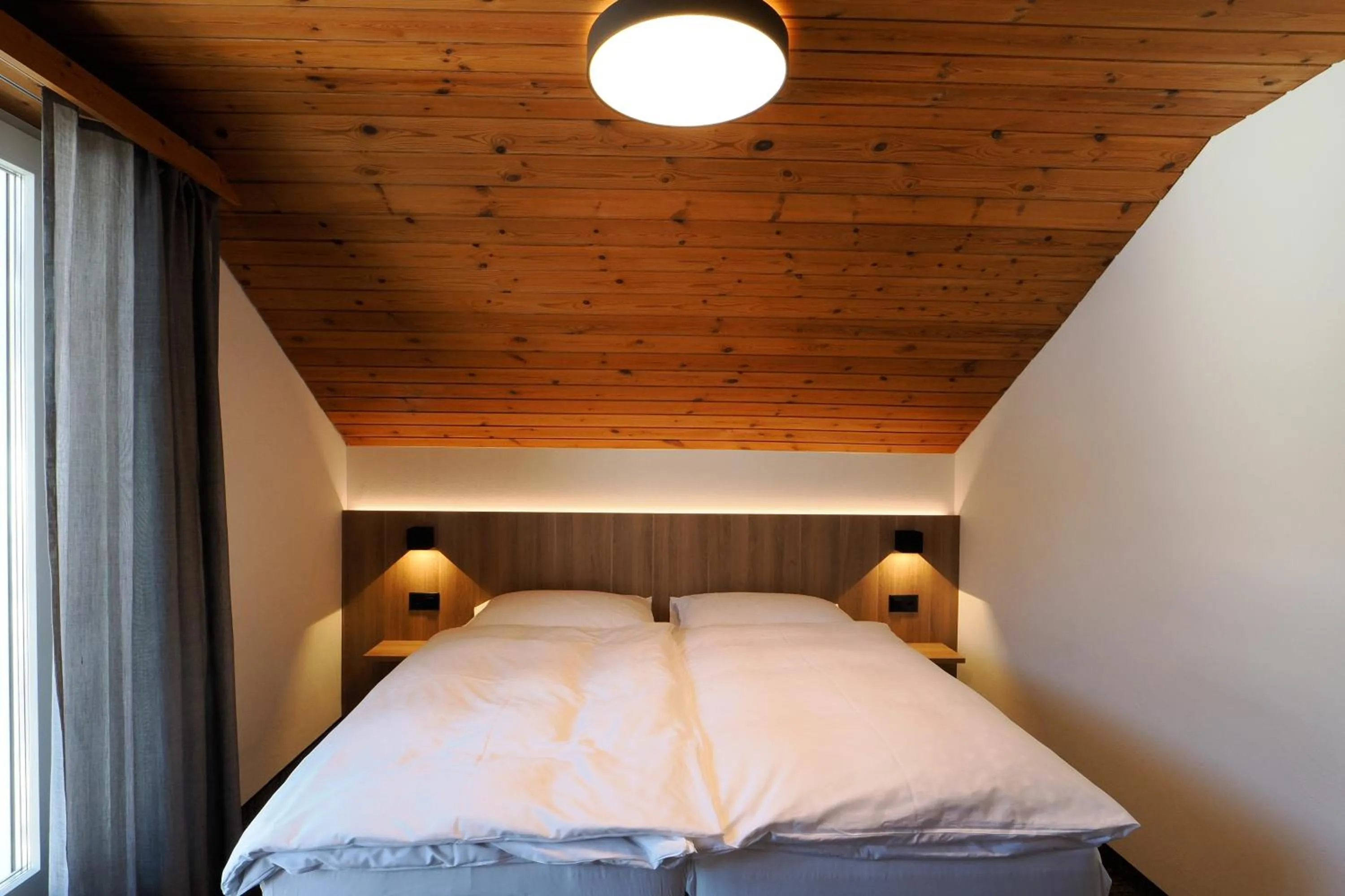 Toilet, Bed in Hotel Alpina Parpan