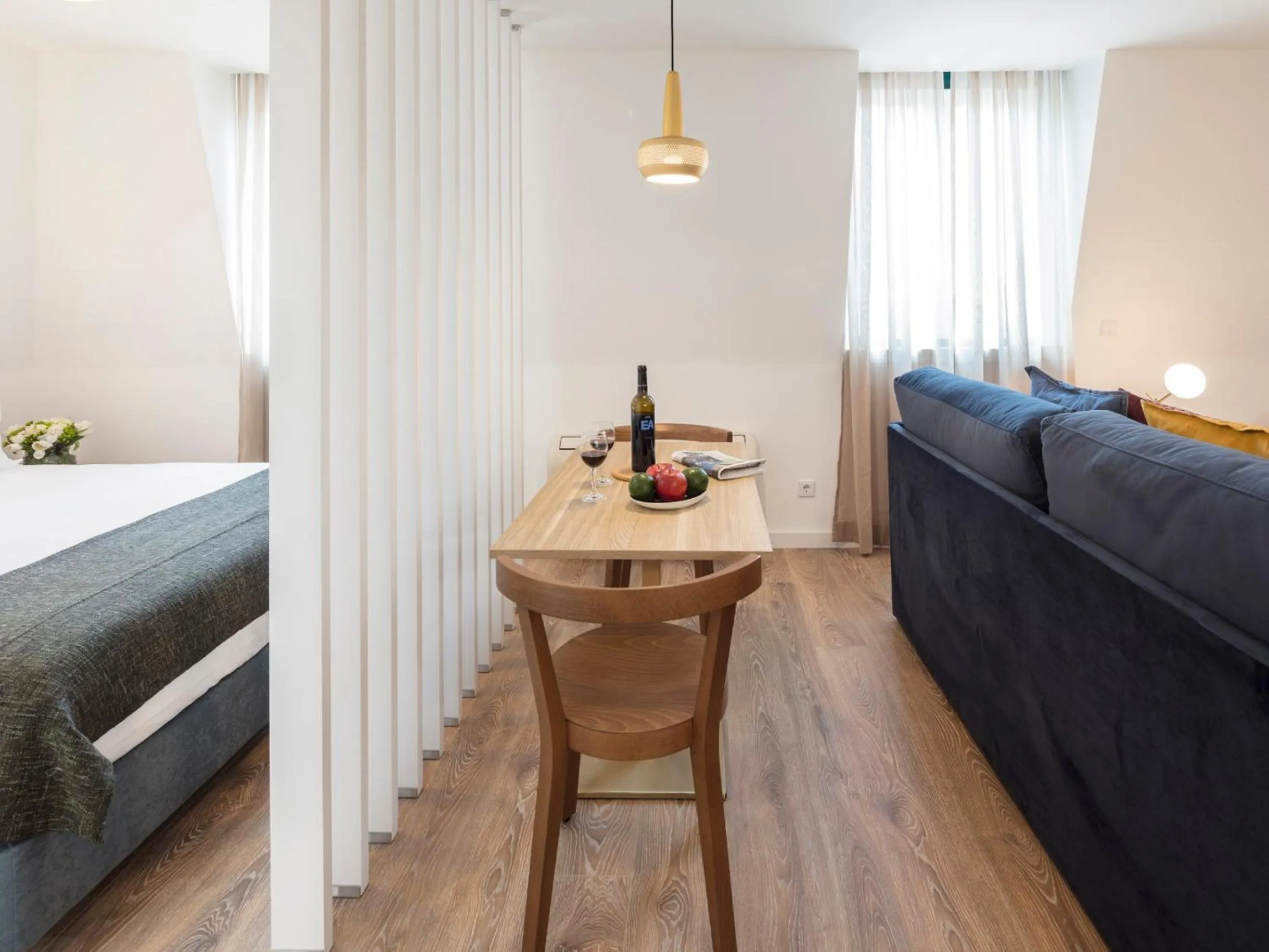 Dining area, Bed in LSA Chiado Emenda by Numa