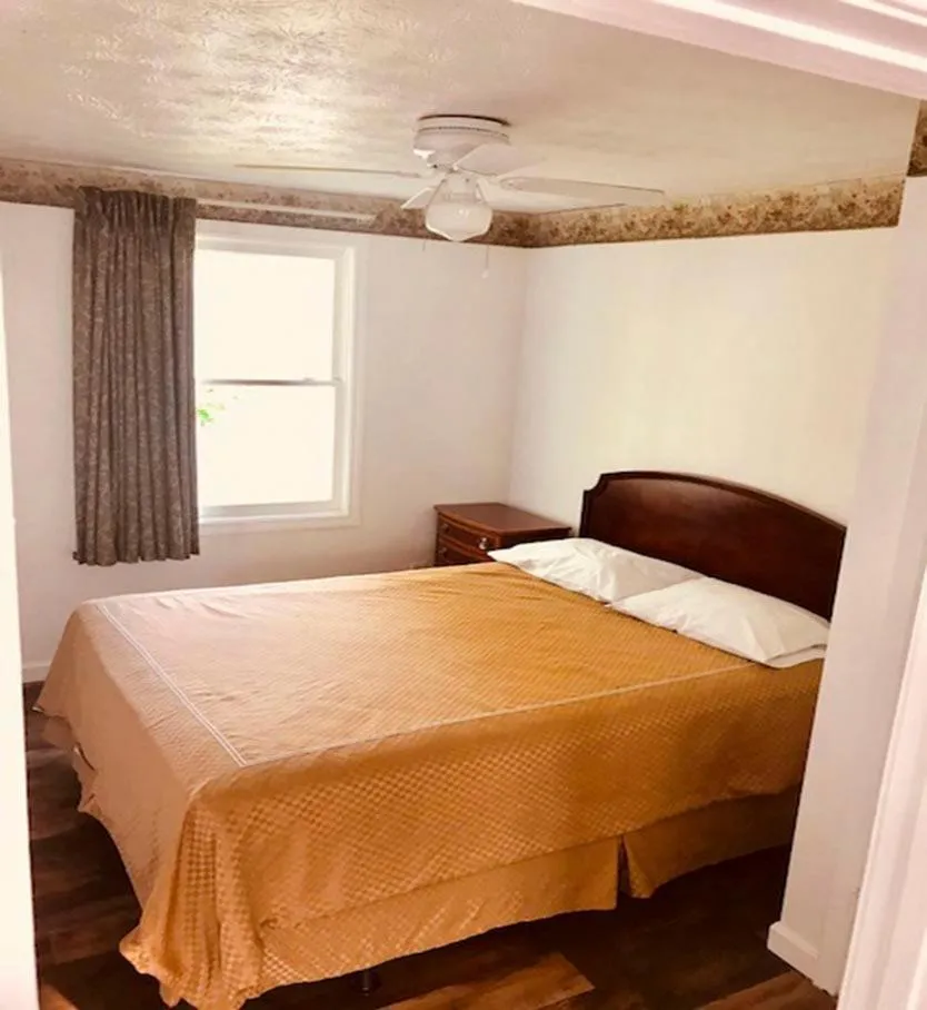 Bed in Exit 5 Resort & Condominium