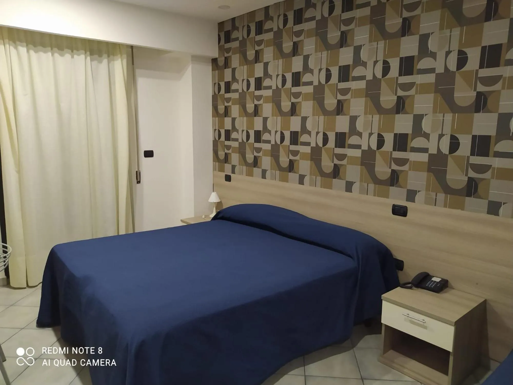 Bed in Hotel Poseidon