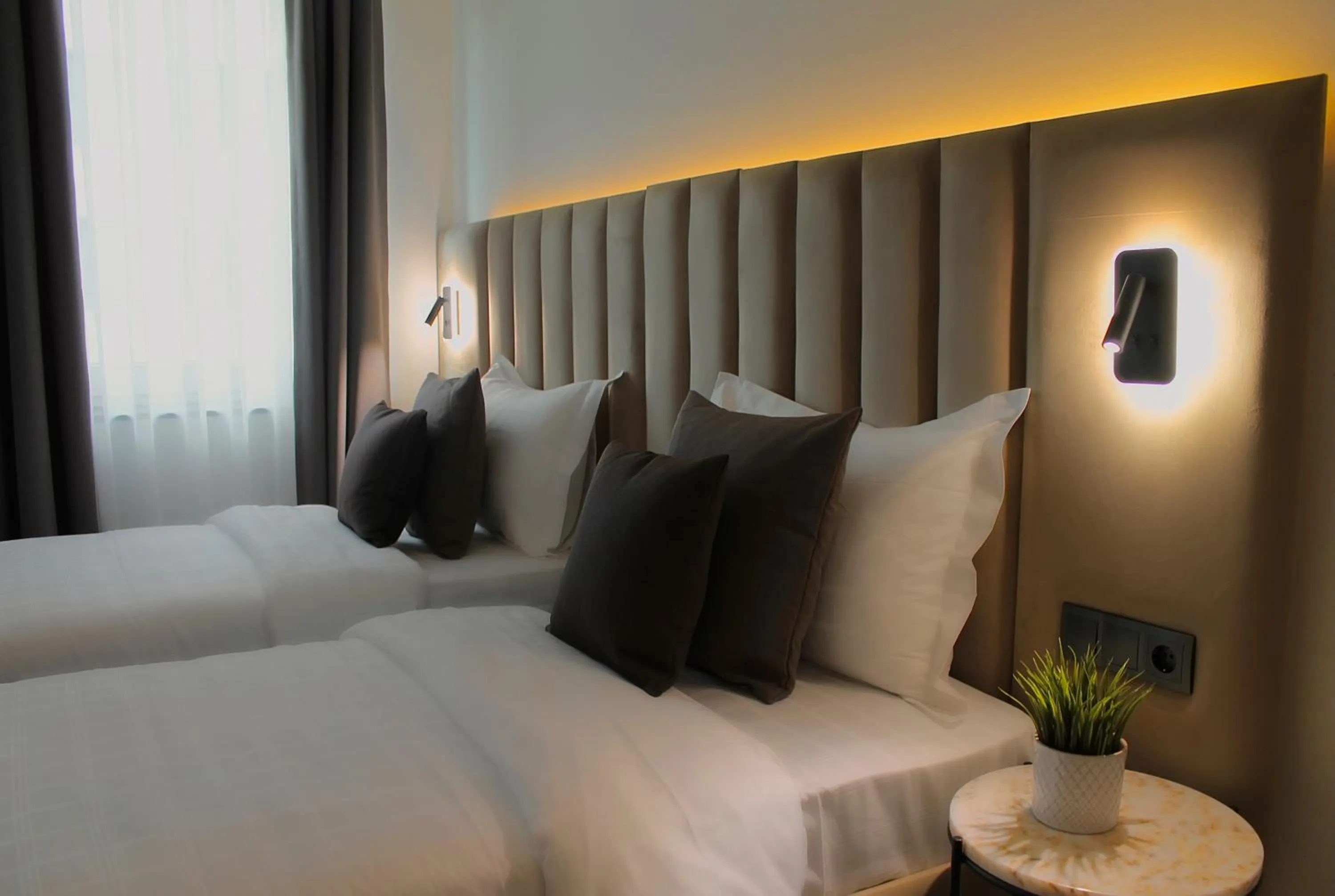 Bed in Bayer's City Hotel