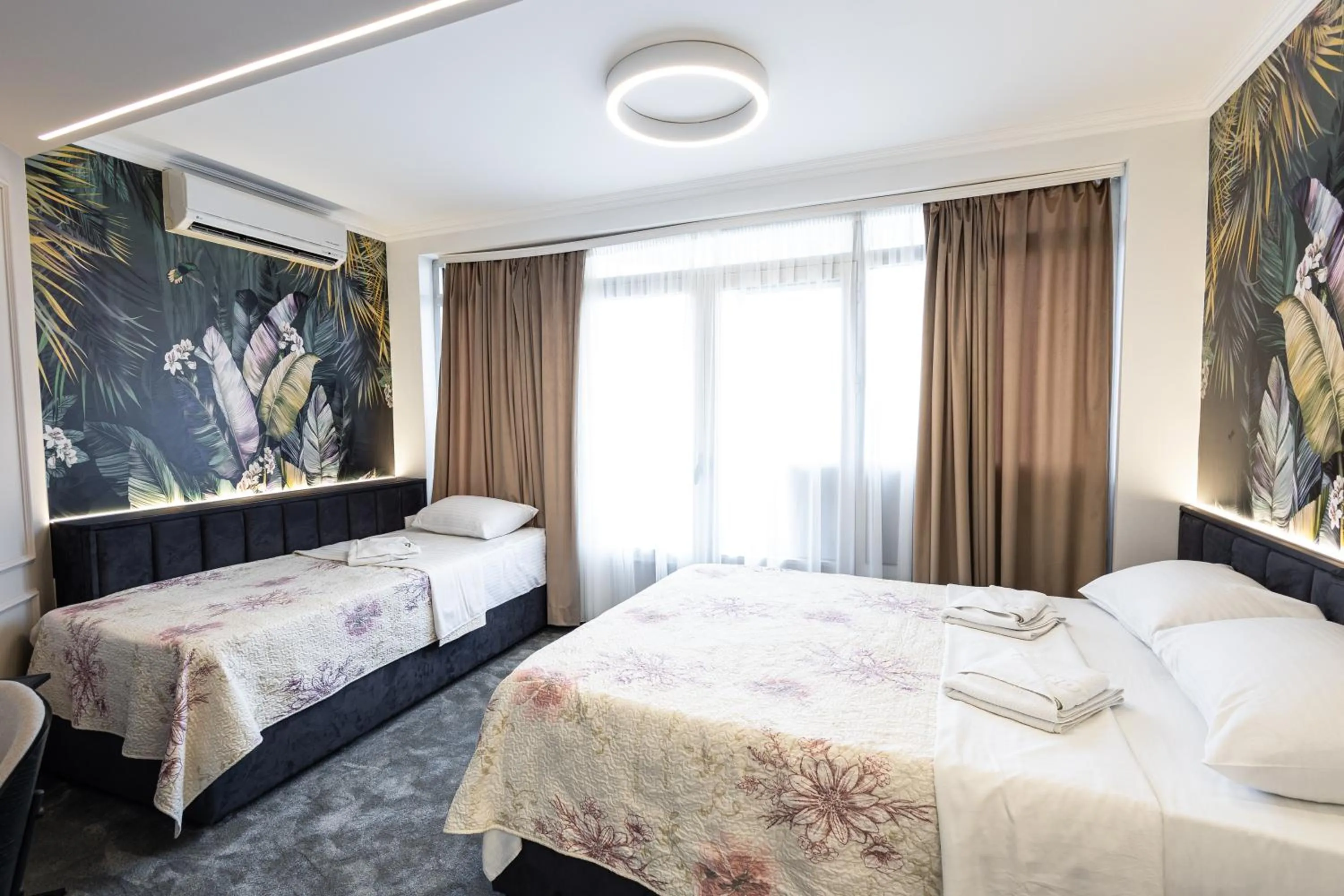 Bed in Garni Hotel Lotos