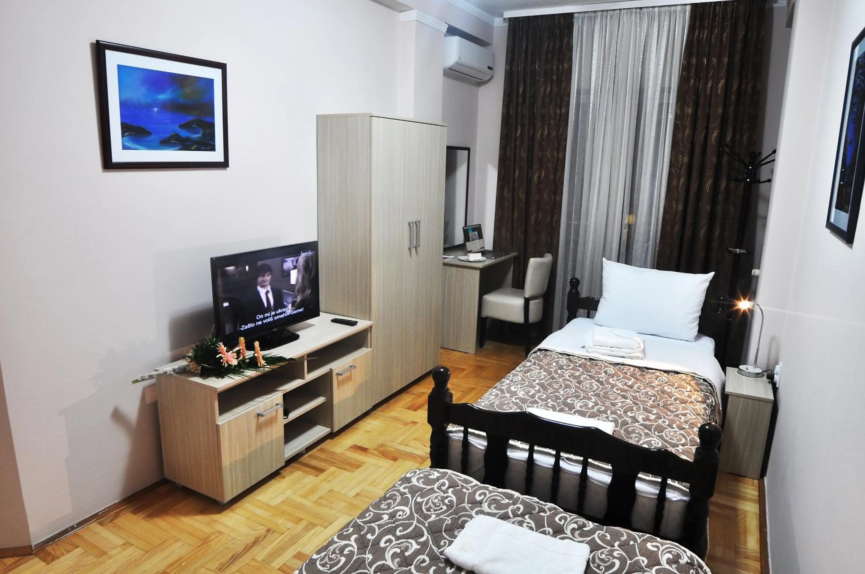 Bed in Garni Hotel Lotos