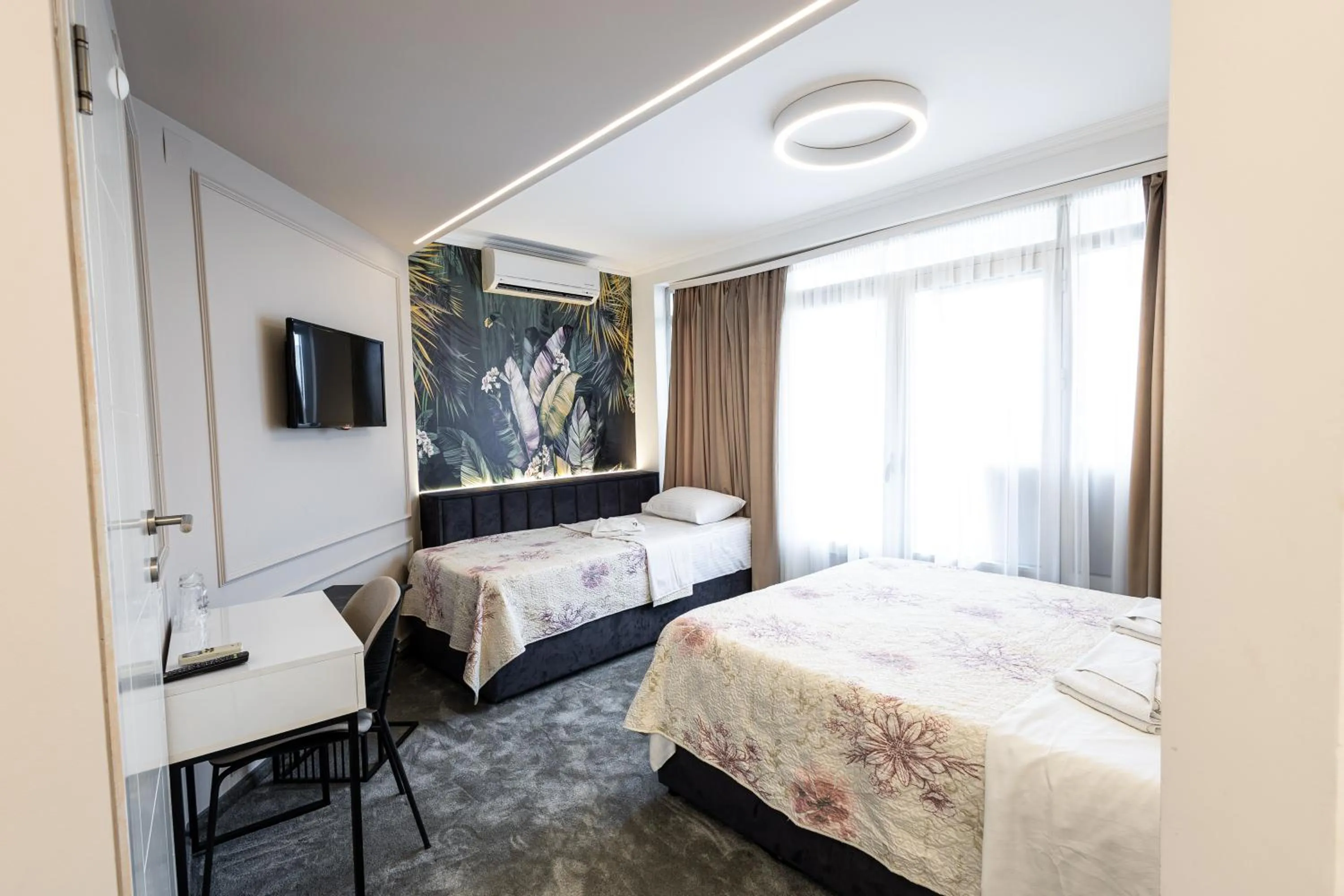 Bed in Garni Hotel Lotos