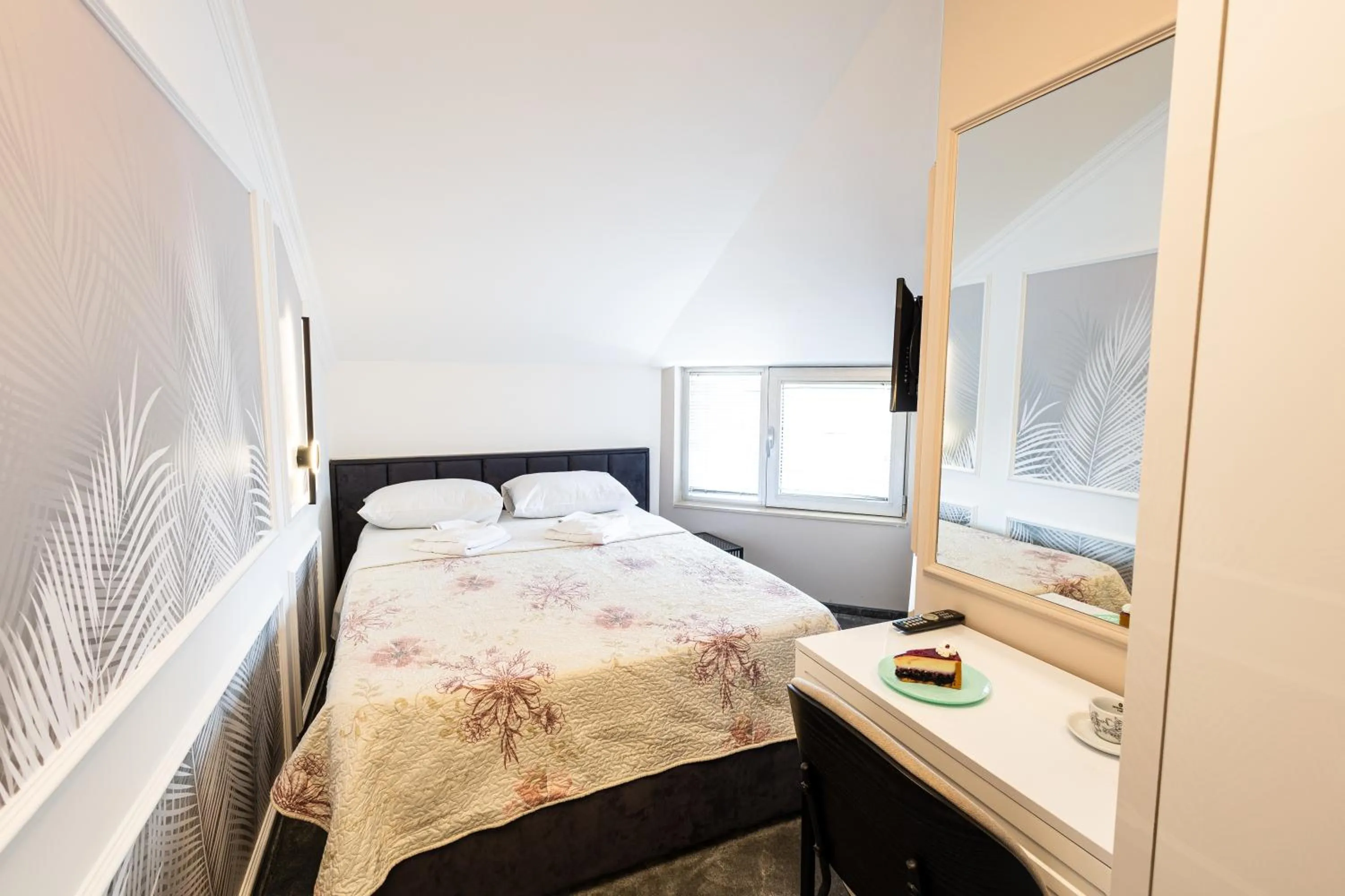 Bed in Garni Hotel Lotos