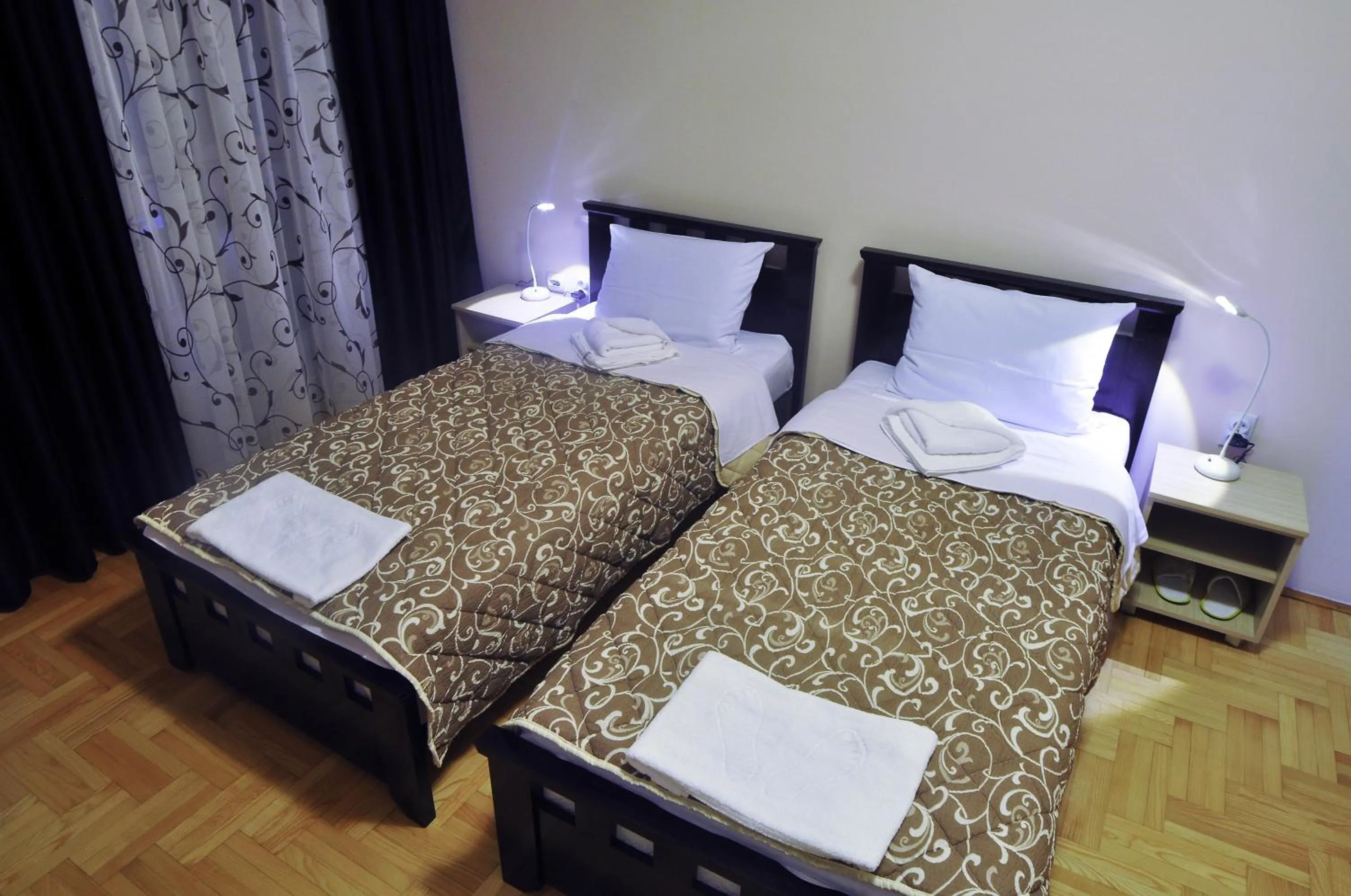 Bed in Garni Hotel Lotos