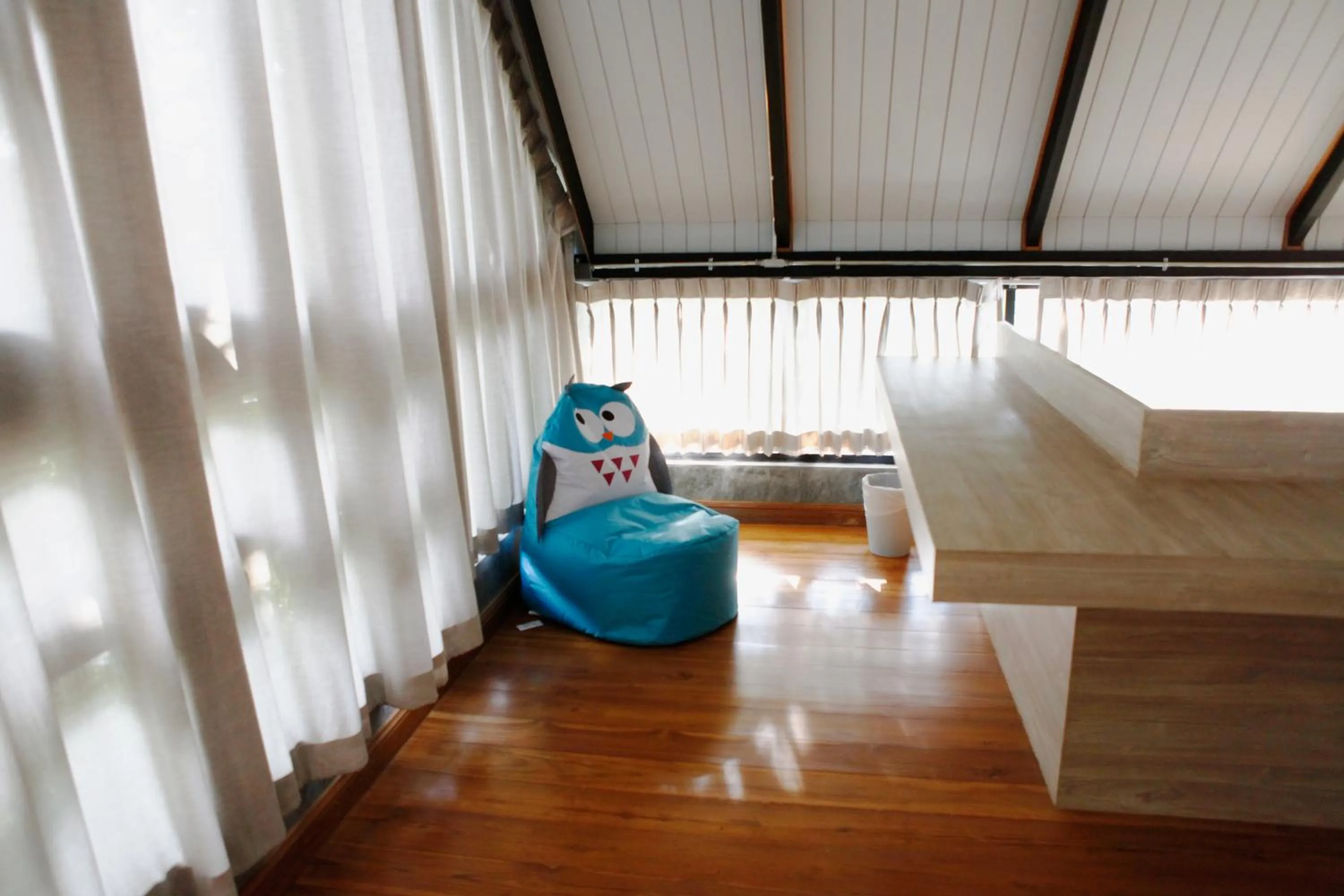 Seating area, Bed in Yellow Pillow village