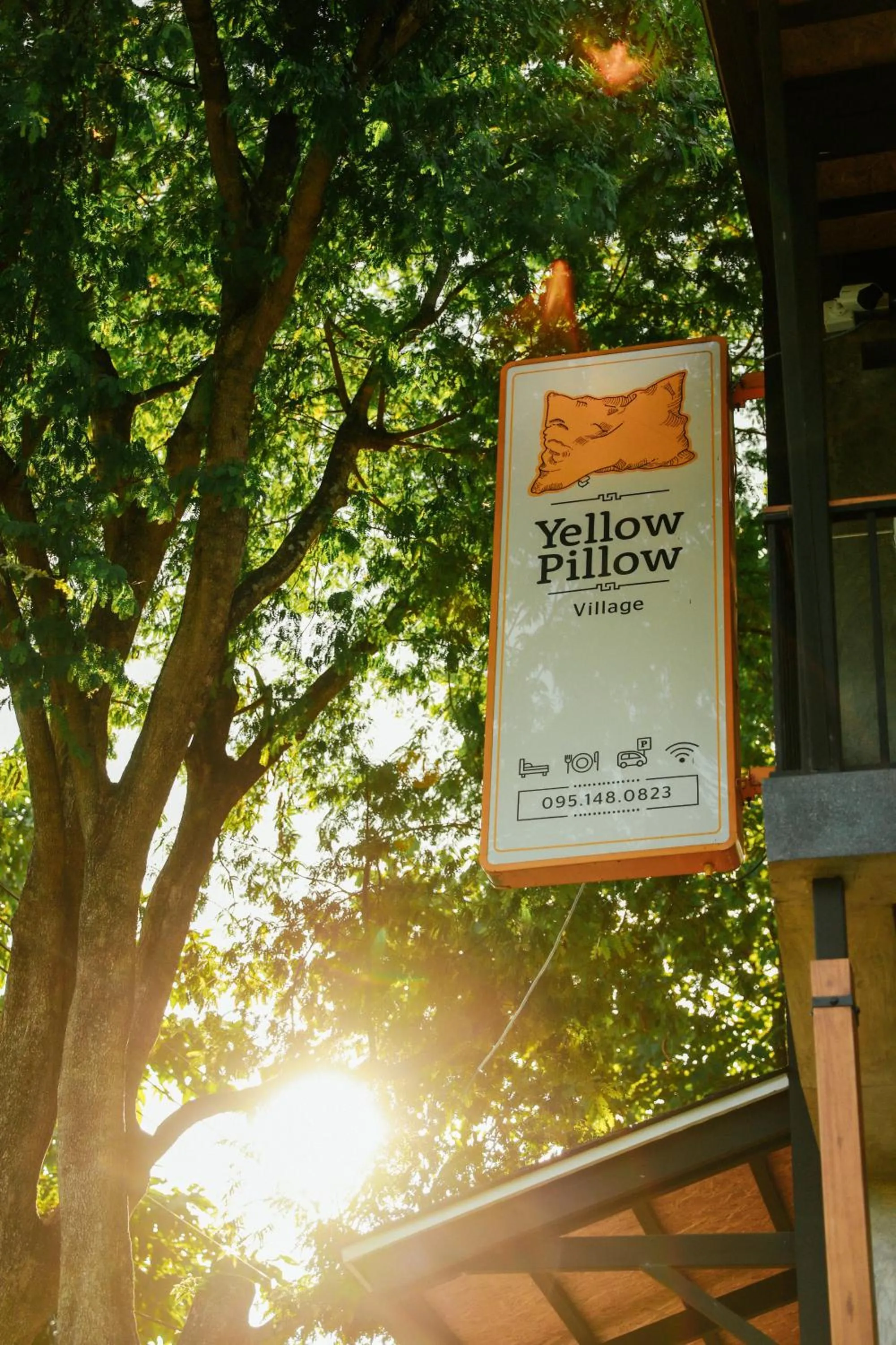 Property logo or sign in Yellow Pillow village