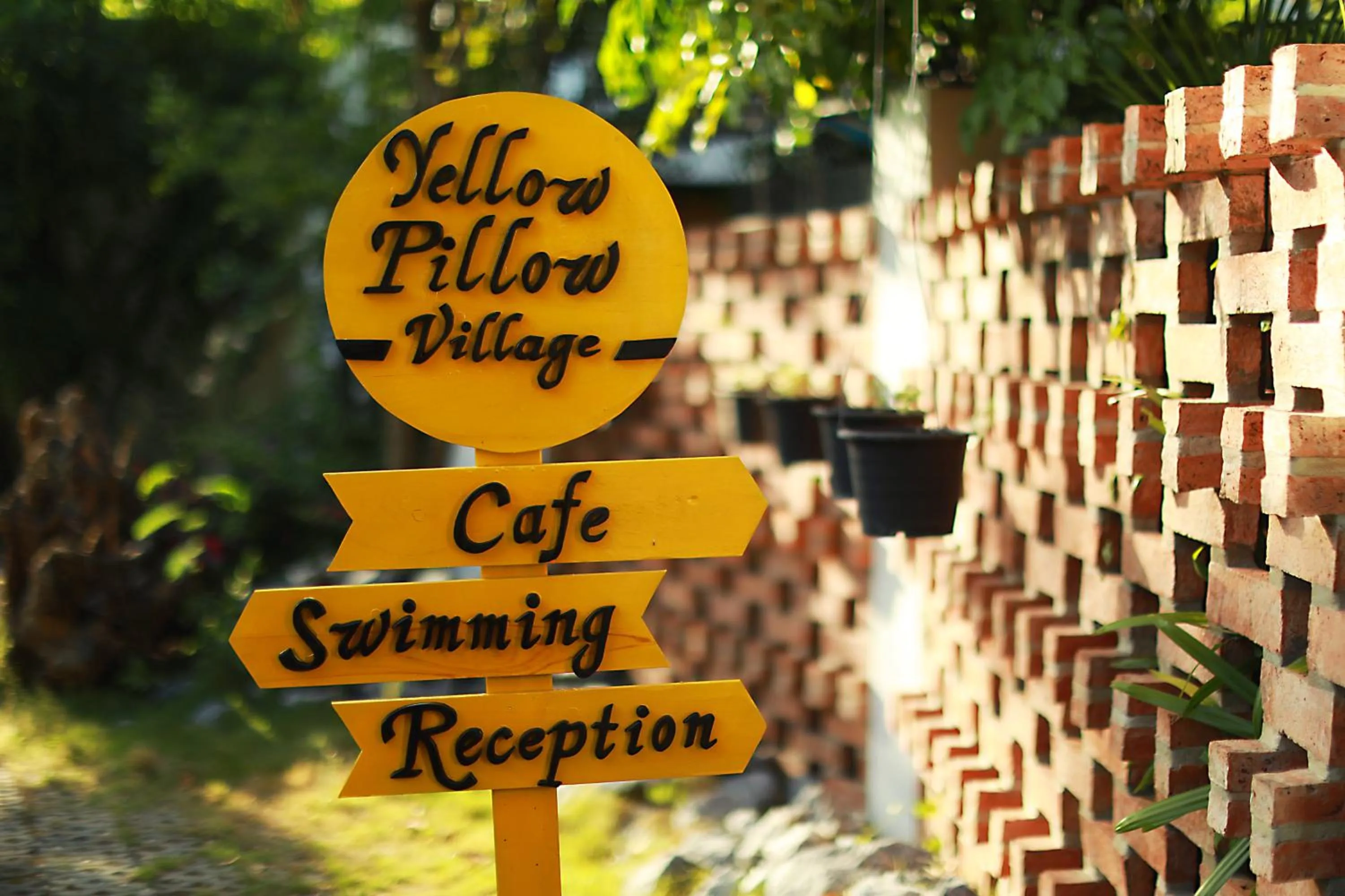 Property logo or sign in Yellow Pillow village