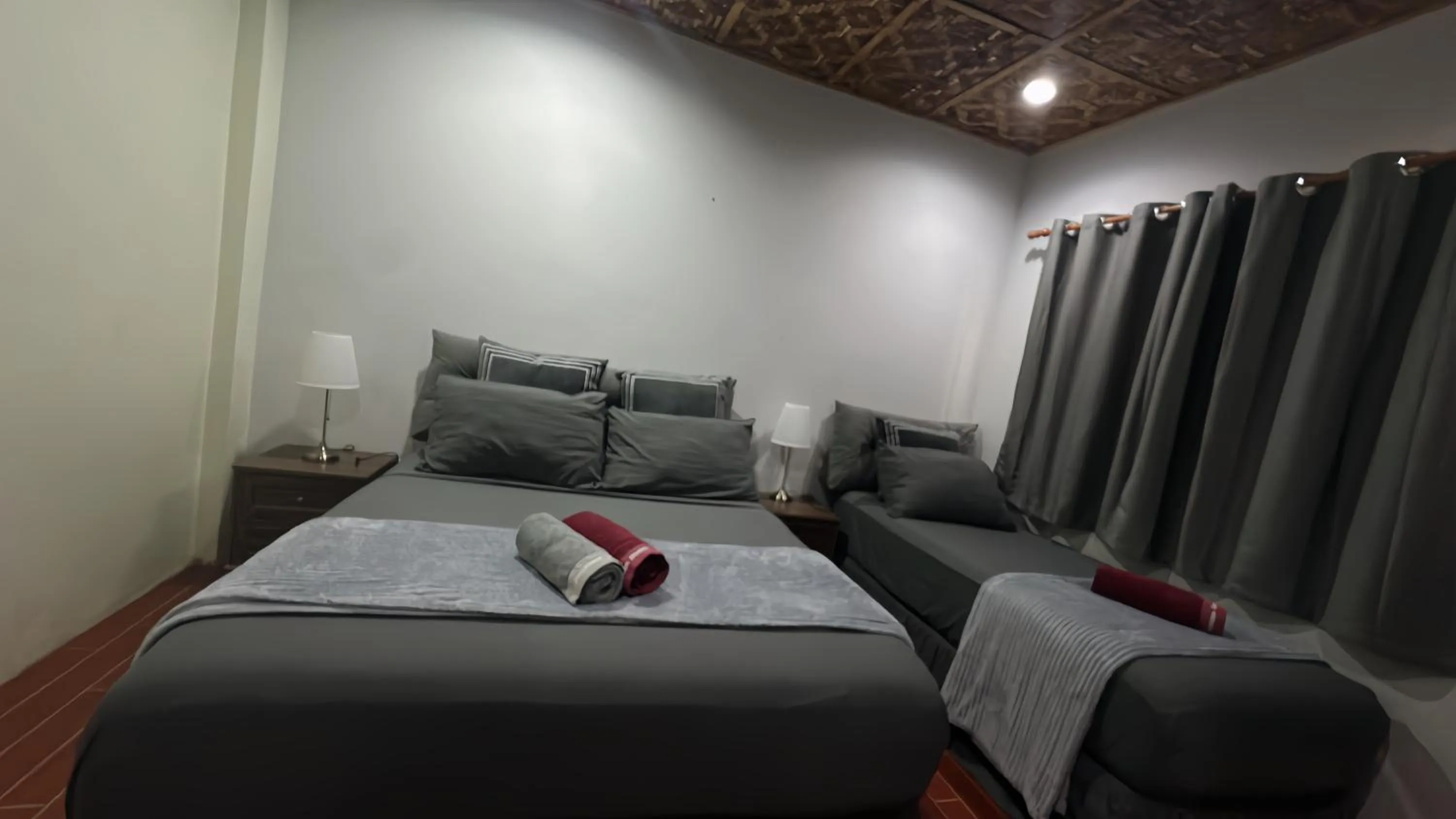 Bed in AivyMaes Divers Resort