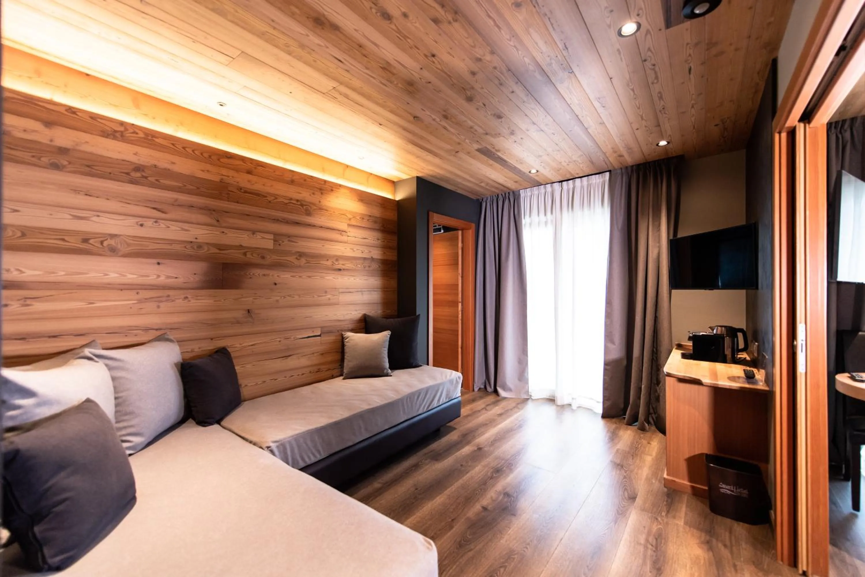 Living room, Bed in Sport Hotel S. Vigilio