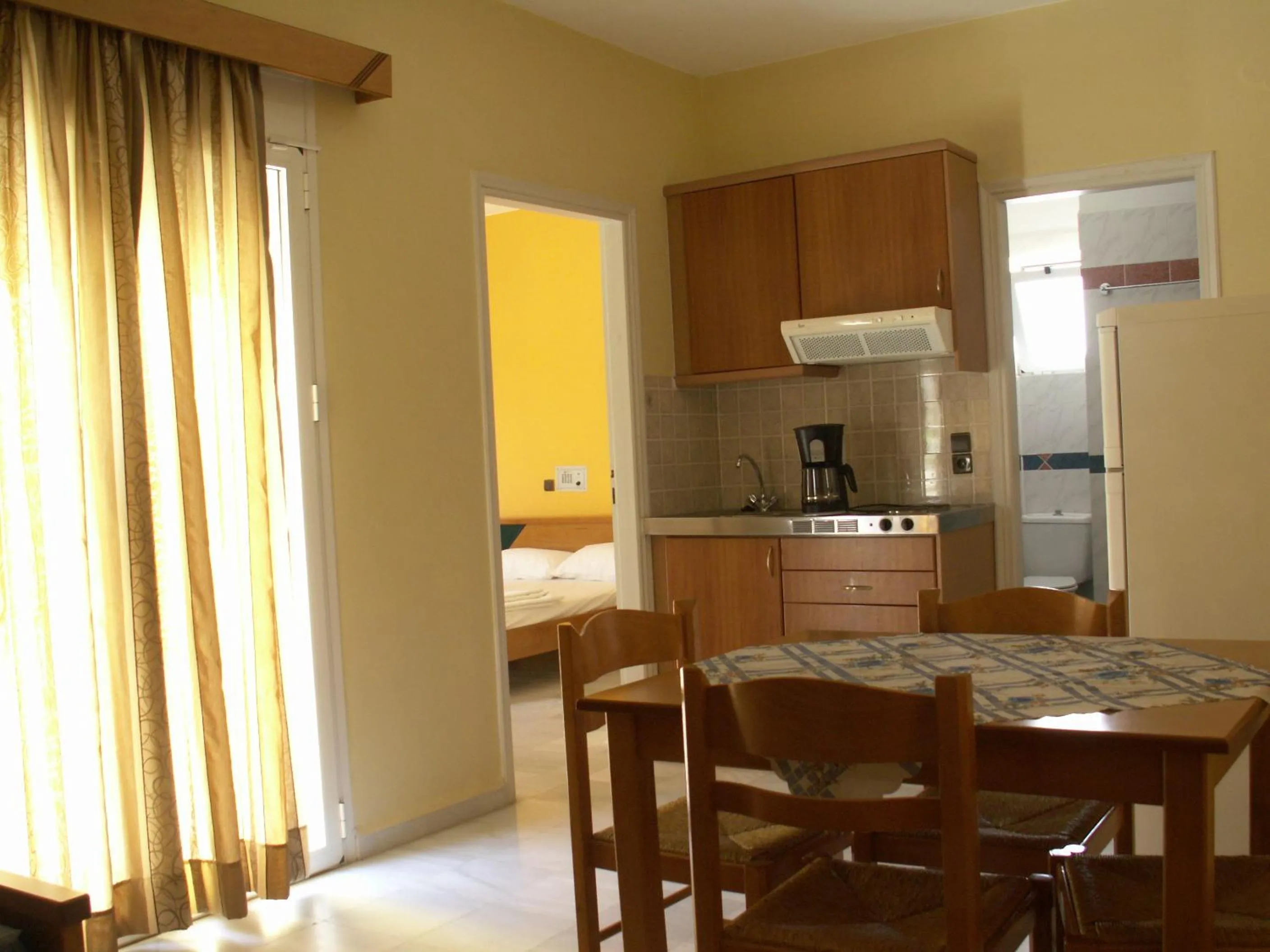 Kitchen or kitchenette in Athena Hotel
