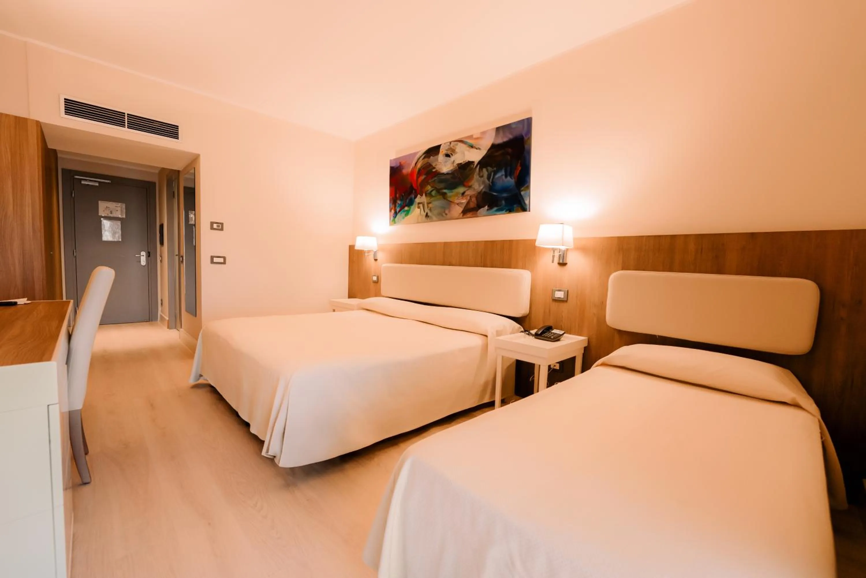 Bed in Hotel Mirasole International