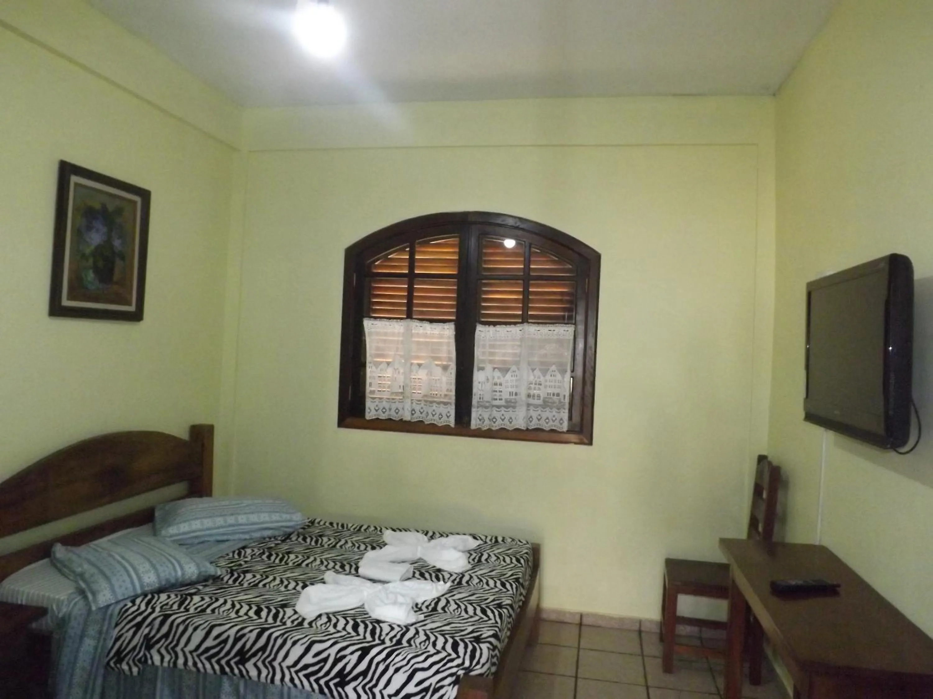 Bed in Francis Hotel Pousada