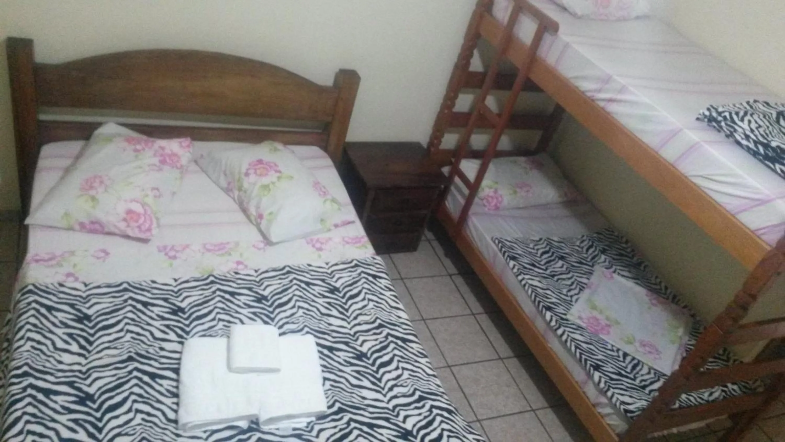 Bed in Francis Hotel Pousada