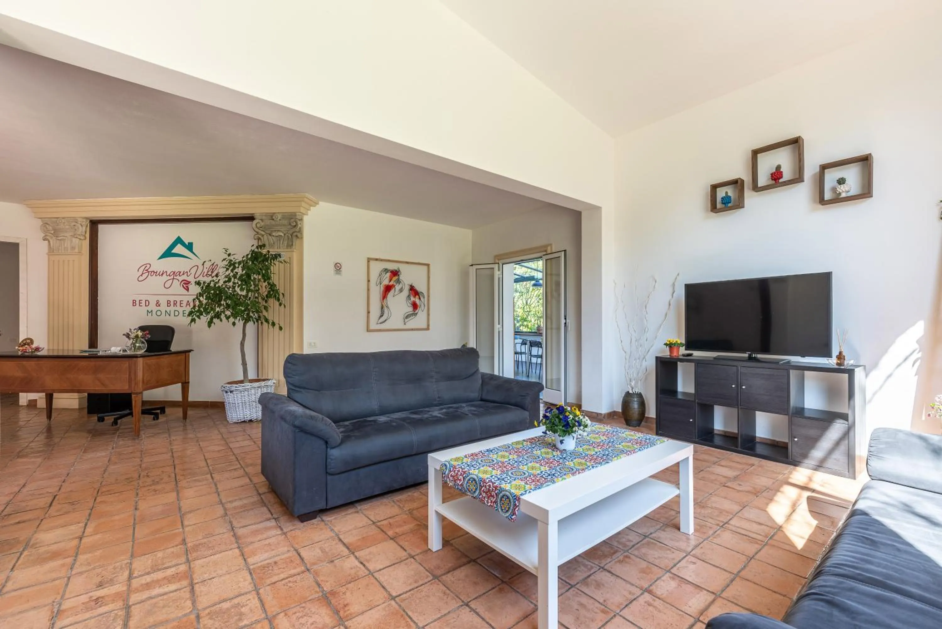 Communal lounge/ TV room in Bouganville Home Mondello
